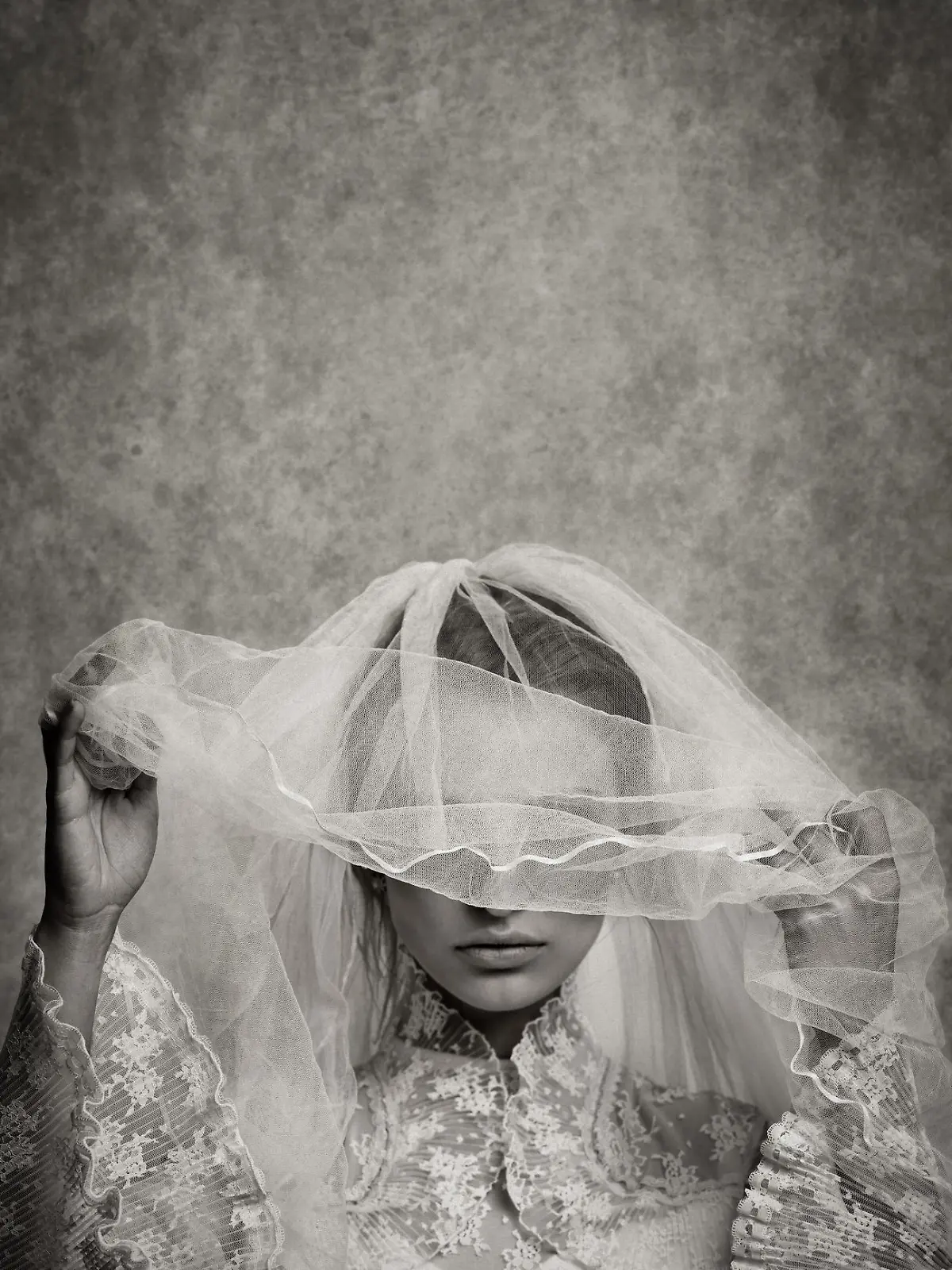 ghostly bride raising her veil - toned image, added grain, texture, vignetting