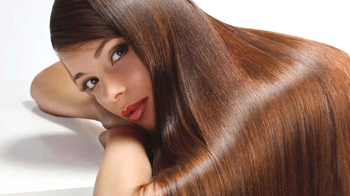 Portrait of Beautiful Woman with smooth gloss long hair. High quality image.
