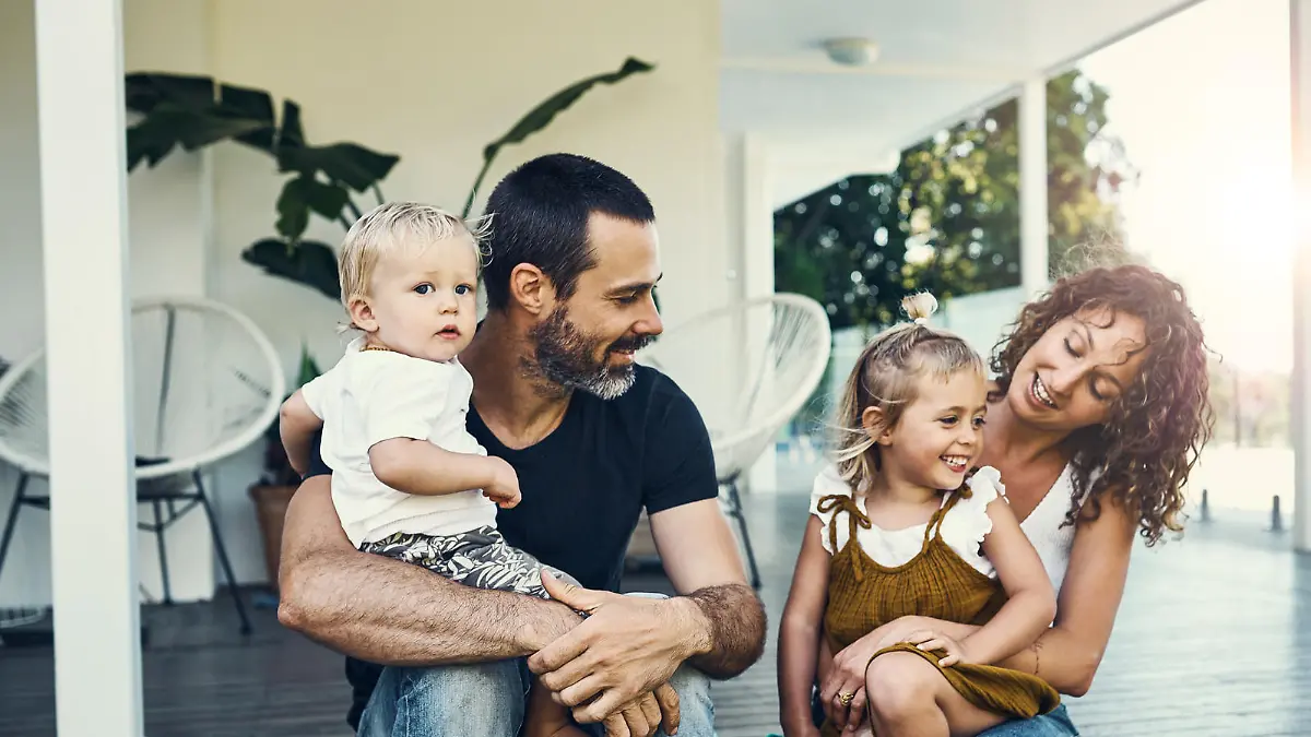 Shot of a happy young family spending the weekend together at home