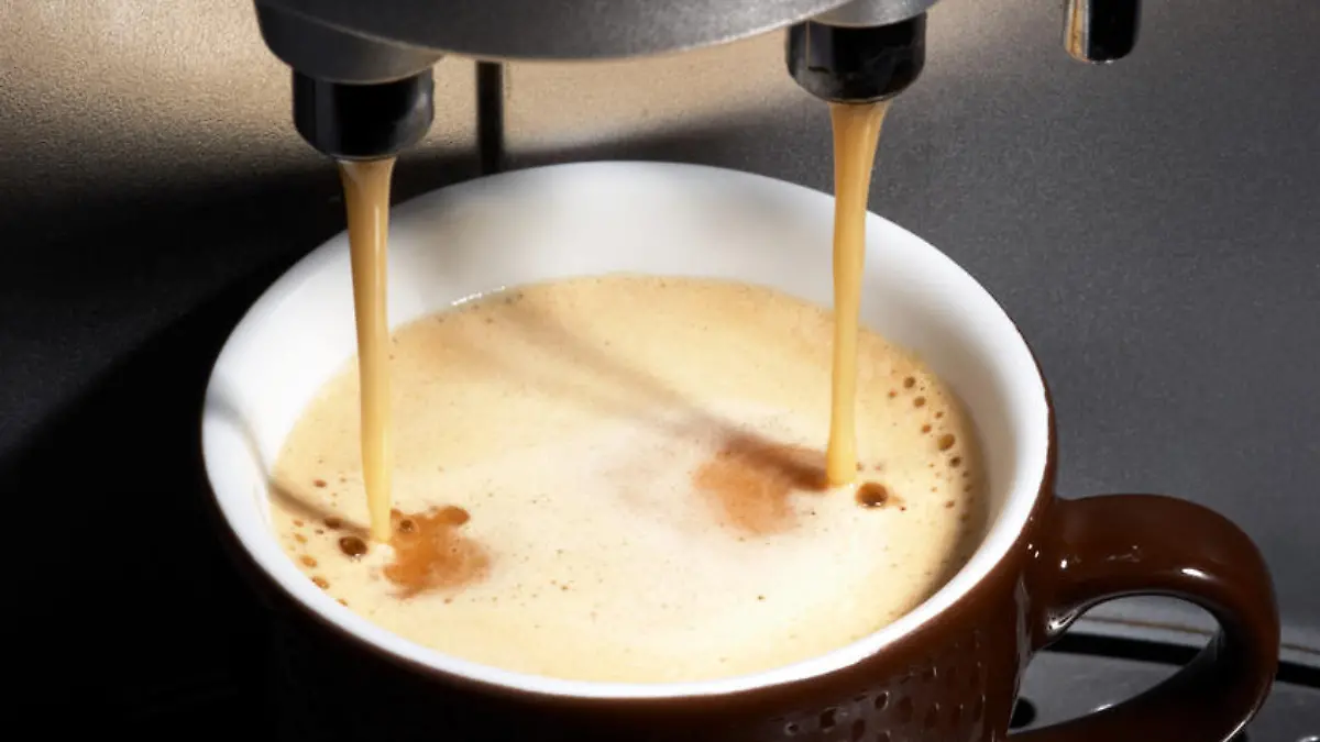 coffe dispenser with cup of coffee