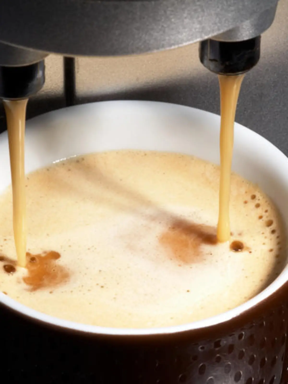 coffe dispenser with cup of coffee