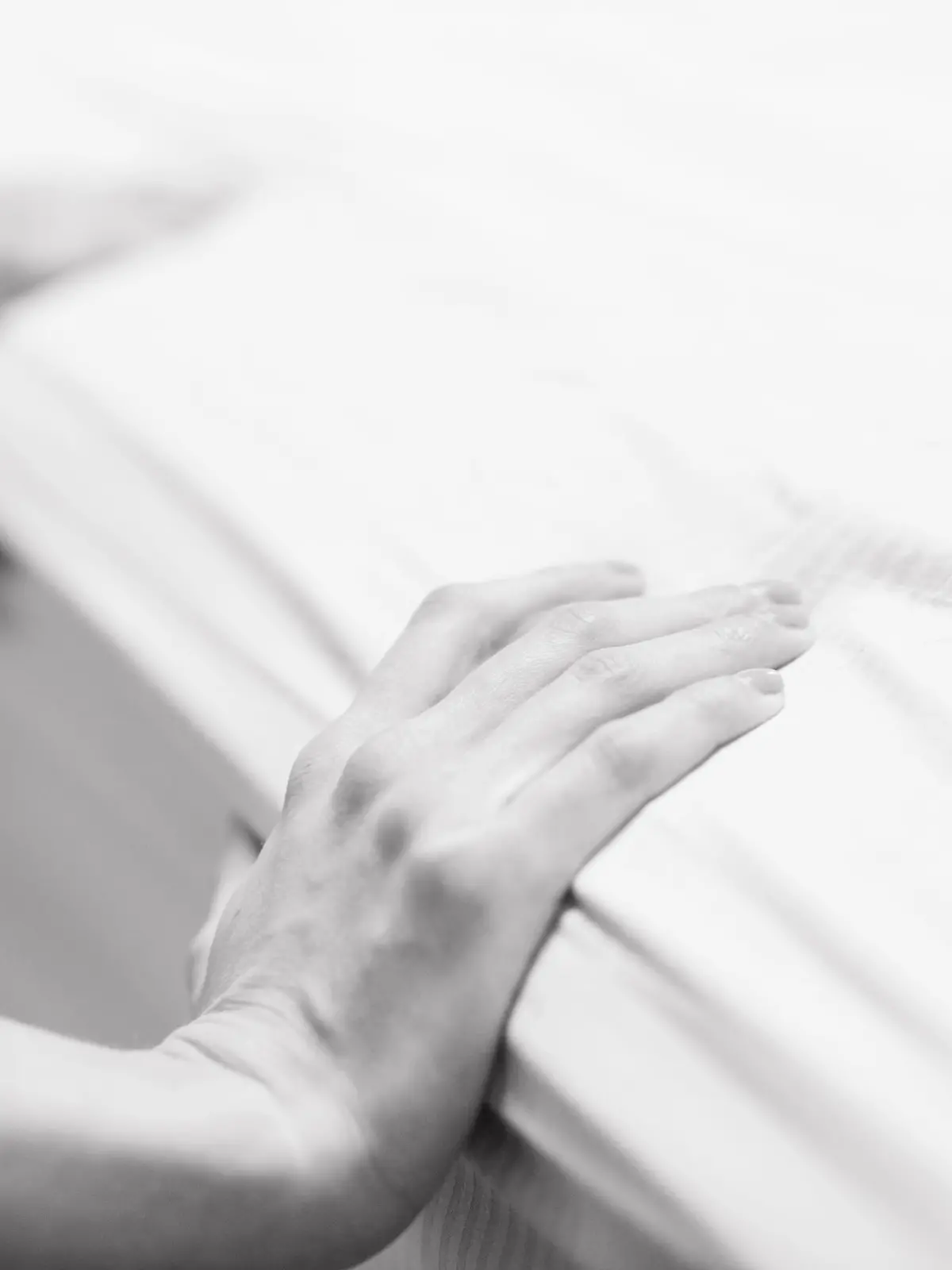 The hands of a mother in labor.