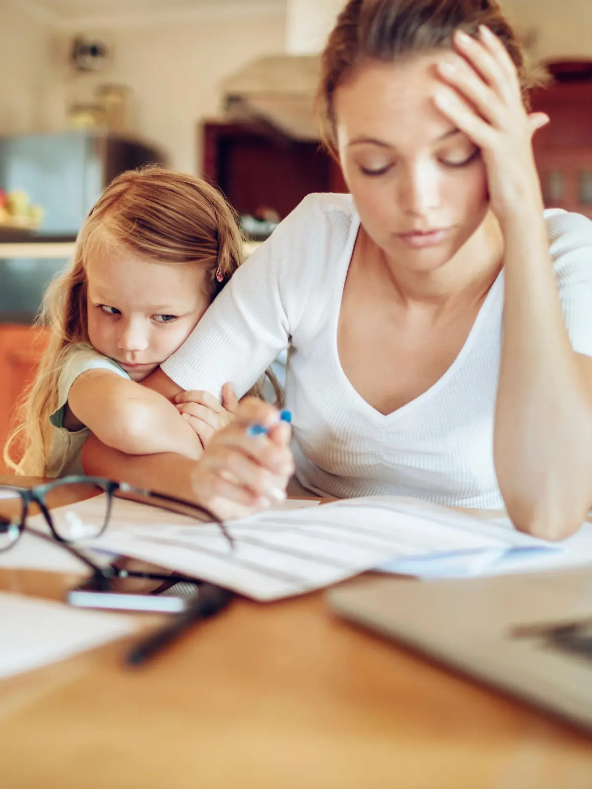 Close up of a mother going through her financials