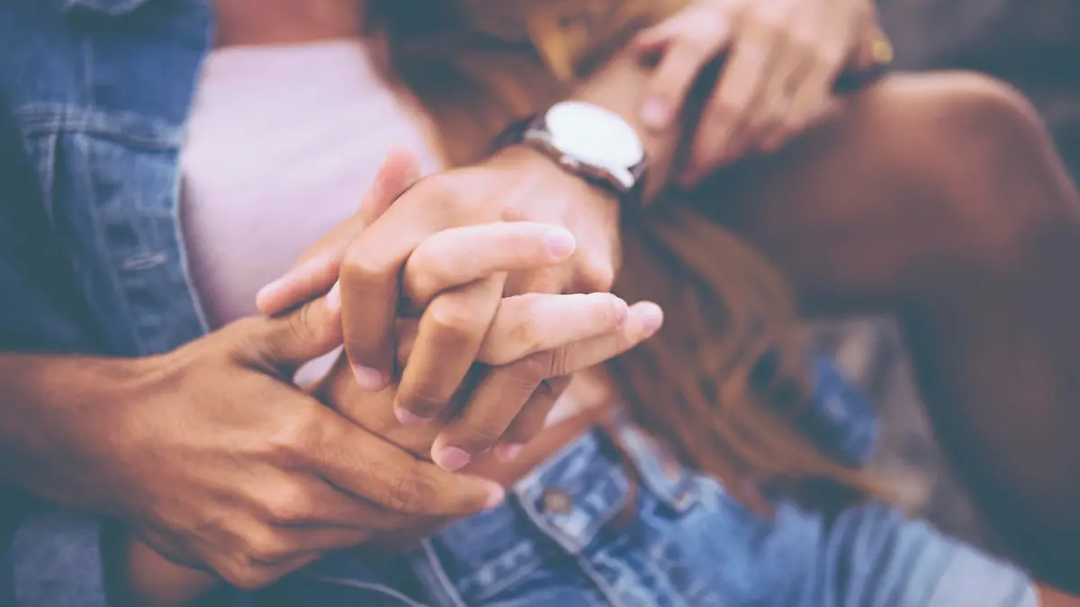 Cropped image of young couple holding hands with a vintage developing style