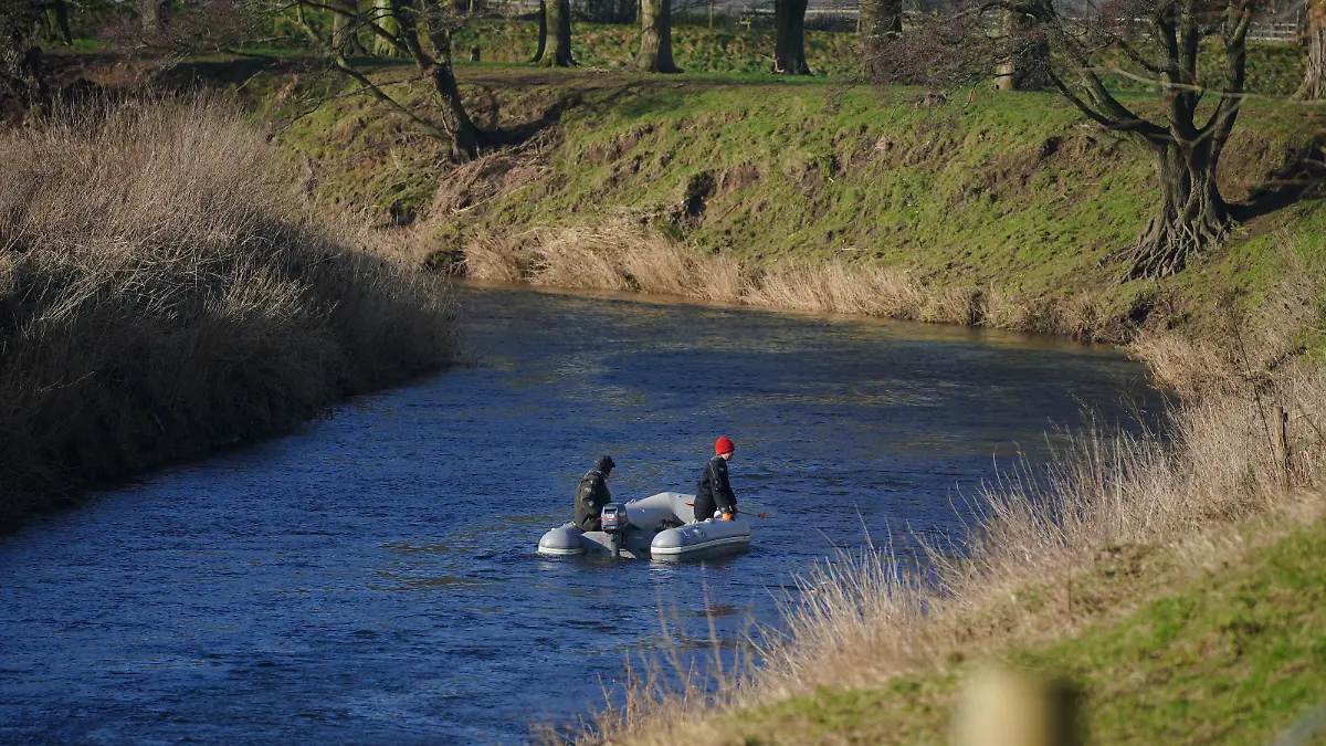 Nicola Bulley missing. Specialist search officers drive a boat along the River Wyre where Lancashire Police are searching for missing woman Nicola Bulley, 45, who was last seen on the morning of Friday January 27, when she was spotted walking her dog on a footpath by the river in St Michael's on Wyre, Lancashire. Picture date: Monday January 30, 2023. Searches have been carried out by Lancashire Police using drones and police dogs over the weekend, with support from Lancashire Fire and Rescue Service, Bowland Pennine Mountain Rescue team and the North West Underwater Search Team. See PA story POLICE Bulley. Photo credit should read: Peter Byrne/PA Wire URN:70794041