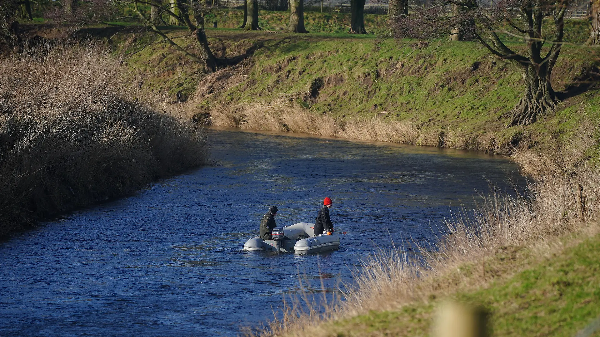 Nicola Bulley missing. Specialist search officers drive a boat along the River Wyre where Lancashire Police are searching for missing woman Nicola Bulley, 45, who was last seen on the morning of Friday January 27, when she was spotted walking her dog on a footpath by the river in St Michael's on Wyre, Lancashire. Picture date: Monday January 30, 2023. Searches have been carried out by Lancashire Police using drones and police dogs over the weekend, with support from Lancashire Fire and Rescue Service, Bowland Pennine Mountain Rescue team and the North West Underwater Search Team. See PA story POLICE Bulley. Photo credit should read: Peter Byrne/PA Wire URN:70794041