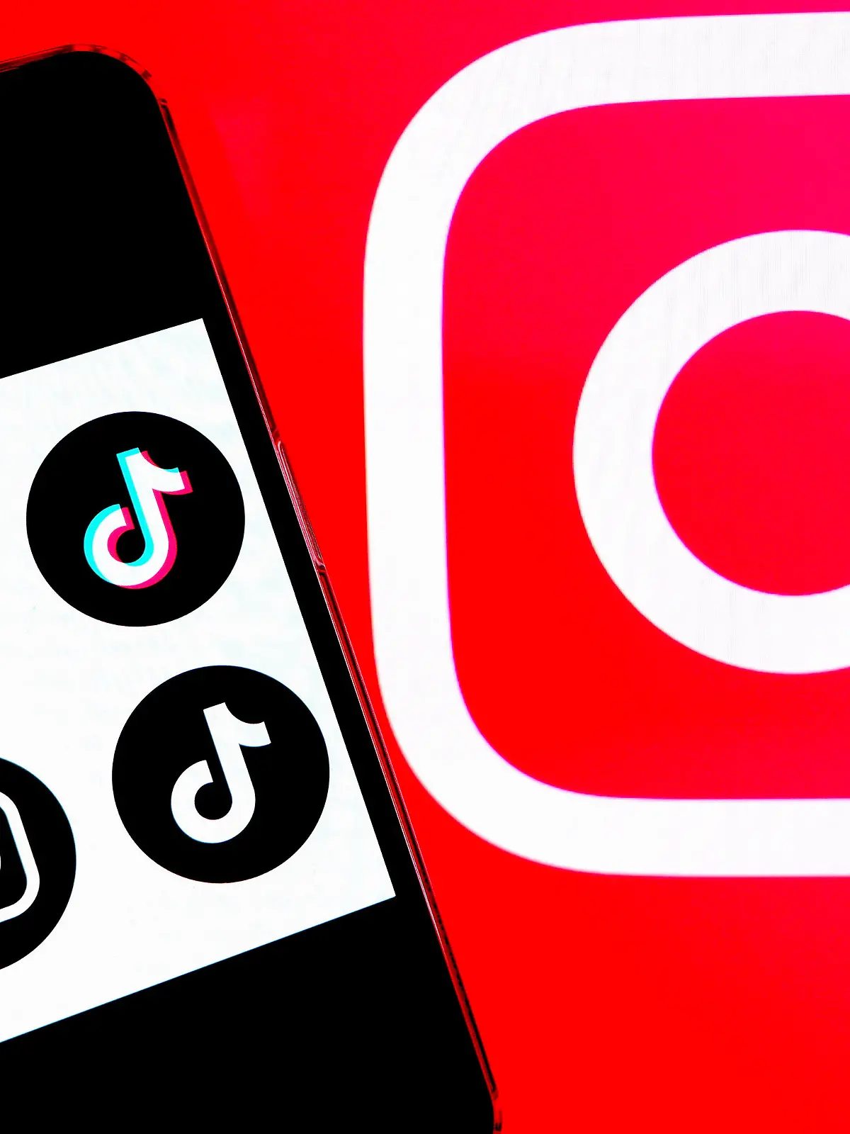 January 30, 2023, India: In this photo illustration, a Tiktok and Instagram logos seen displayed on a smartphone with an Instagram logo in the background. (Credit Image: © Avishek Das/SOPA Images via ZUMA Press Wire