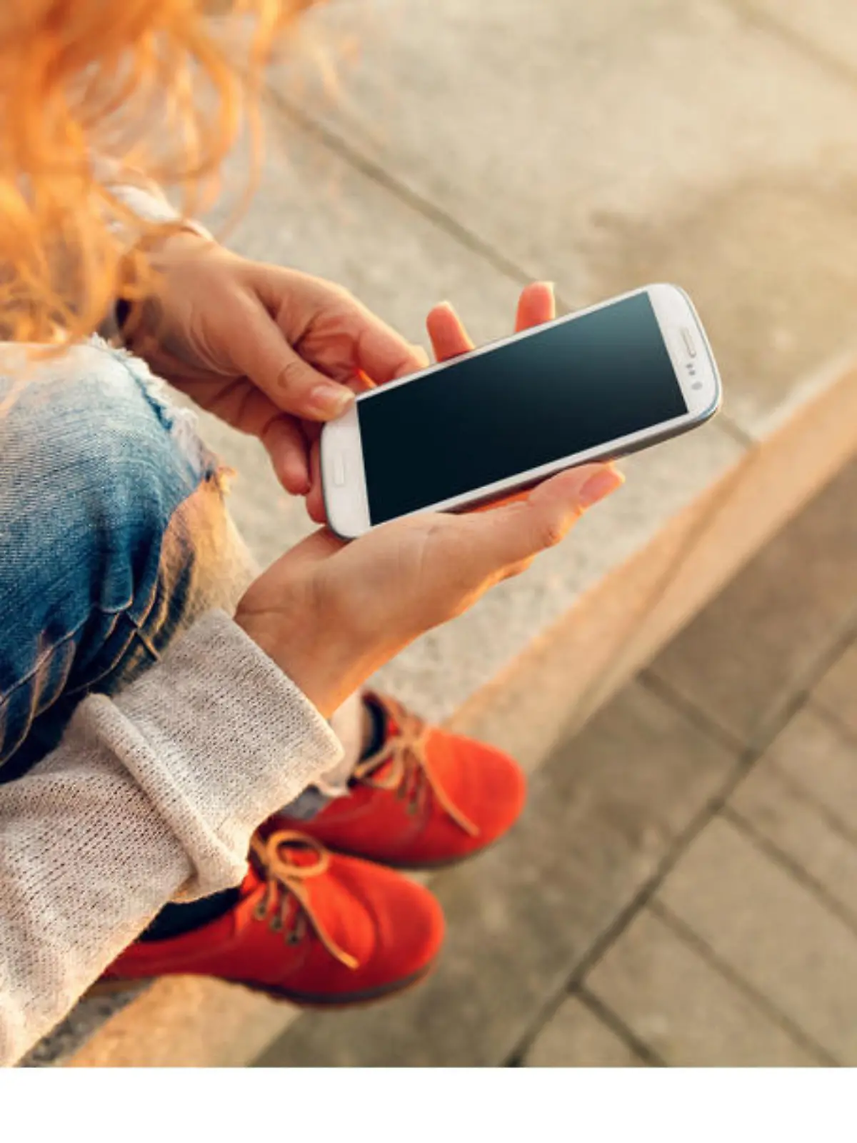 Beautiful young  hipster woman using smart phone at beach