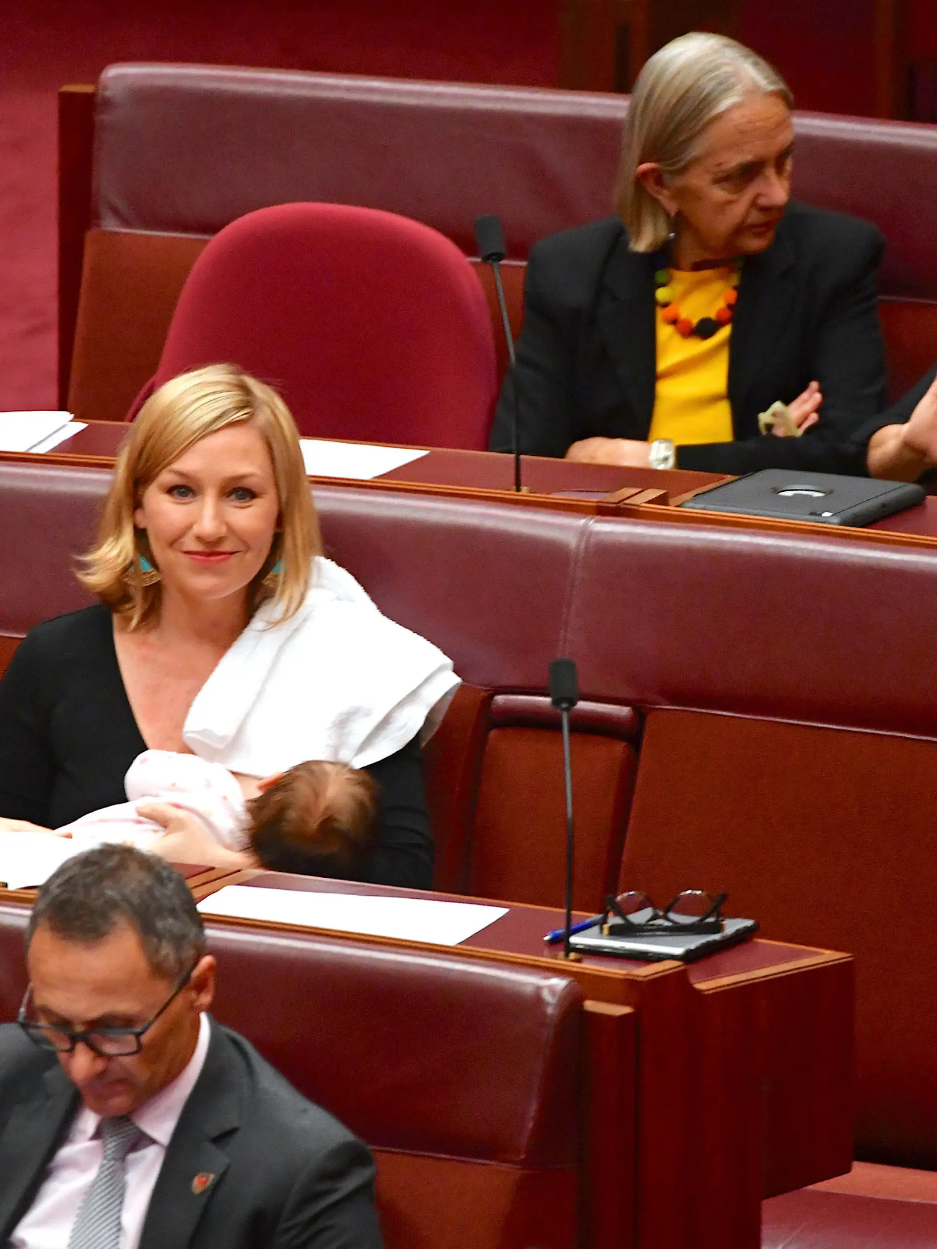 Australian Senator Larissa Waters reacts as she breastfeeds her baby in the Senate Chamber at Parliament House in Canberra, Australia, May 9, 2017. AAP/Mick Tsikas/via REUTERS    ATTENTION EDITORS - THIS IMAGE WAS PROVIDED BY A THIRD PARTY. EDITORIAL USE ONLY. NO RESALES. NO ARCHIVE. AUSTRALIA OUT. NEW ZEALAND OUT.