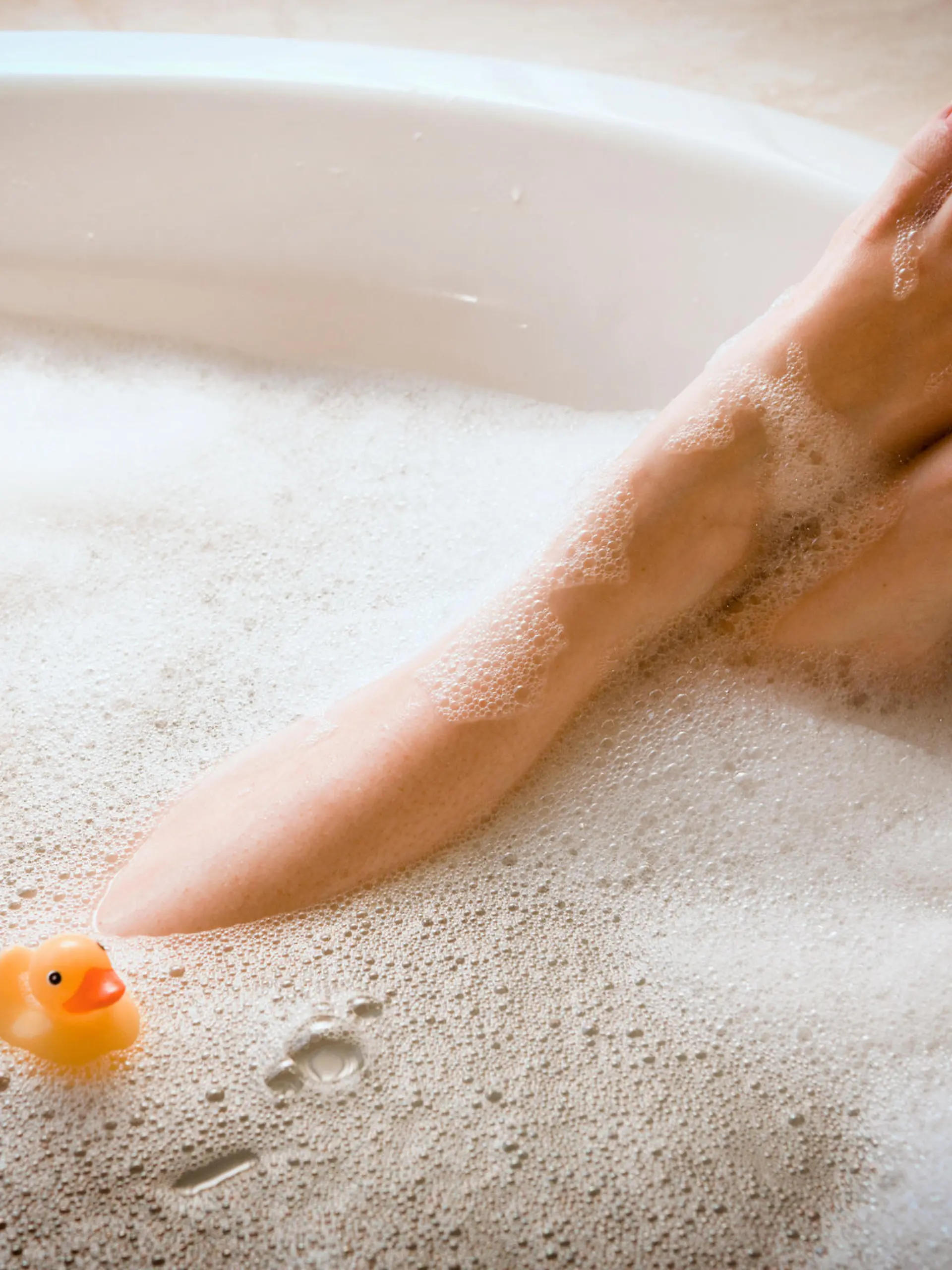 Woman in bathtub. Bubble Bath. Horizontal shot.