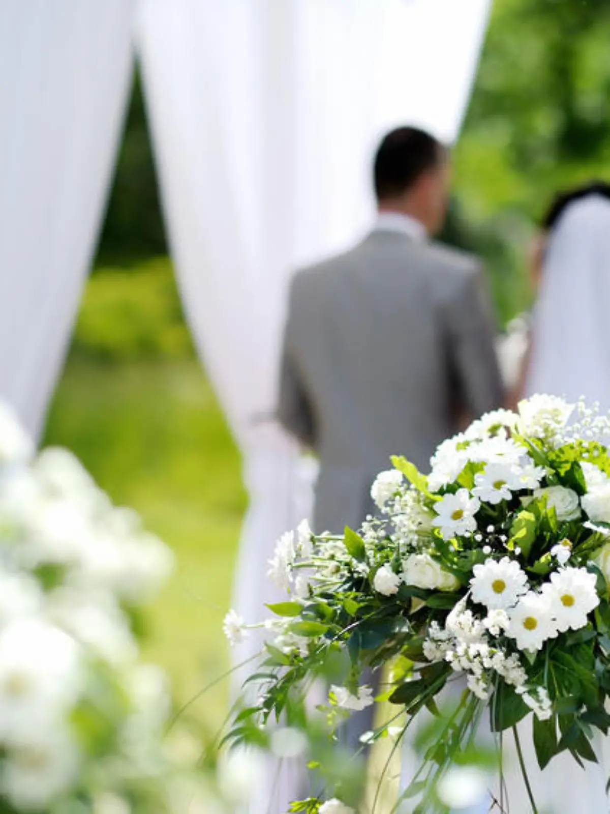 White flowers decorations during outdoor wedding ceremony