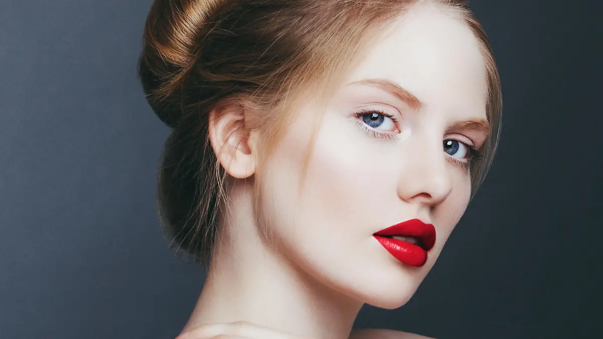 Natural portrait of beautiful blonde woman with red lips.