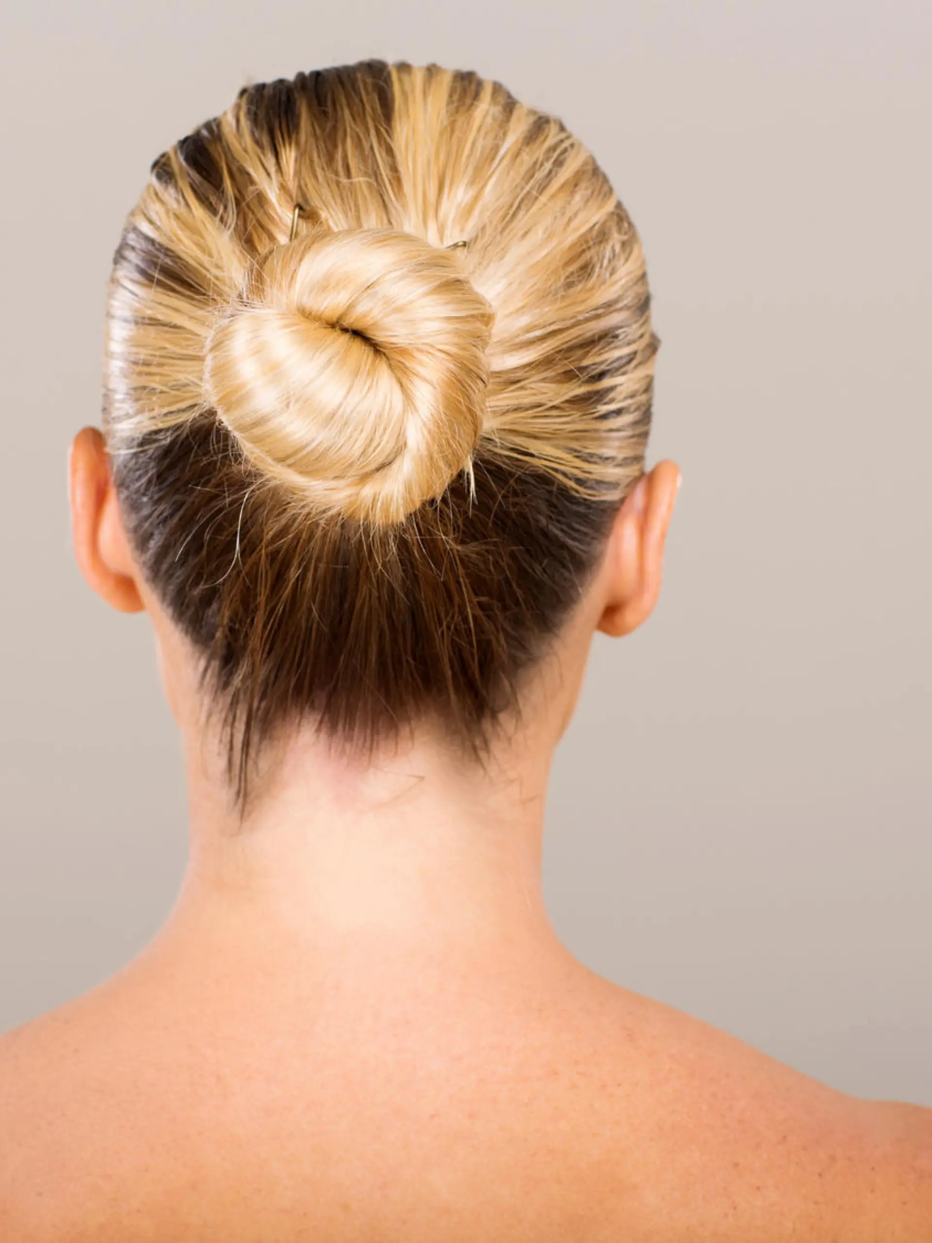 rear view of young woman with hair bun