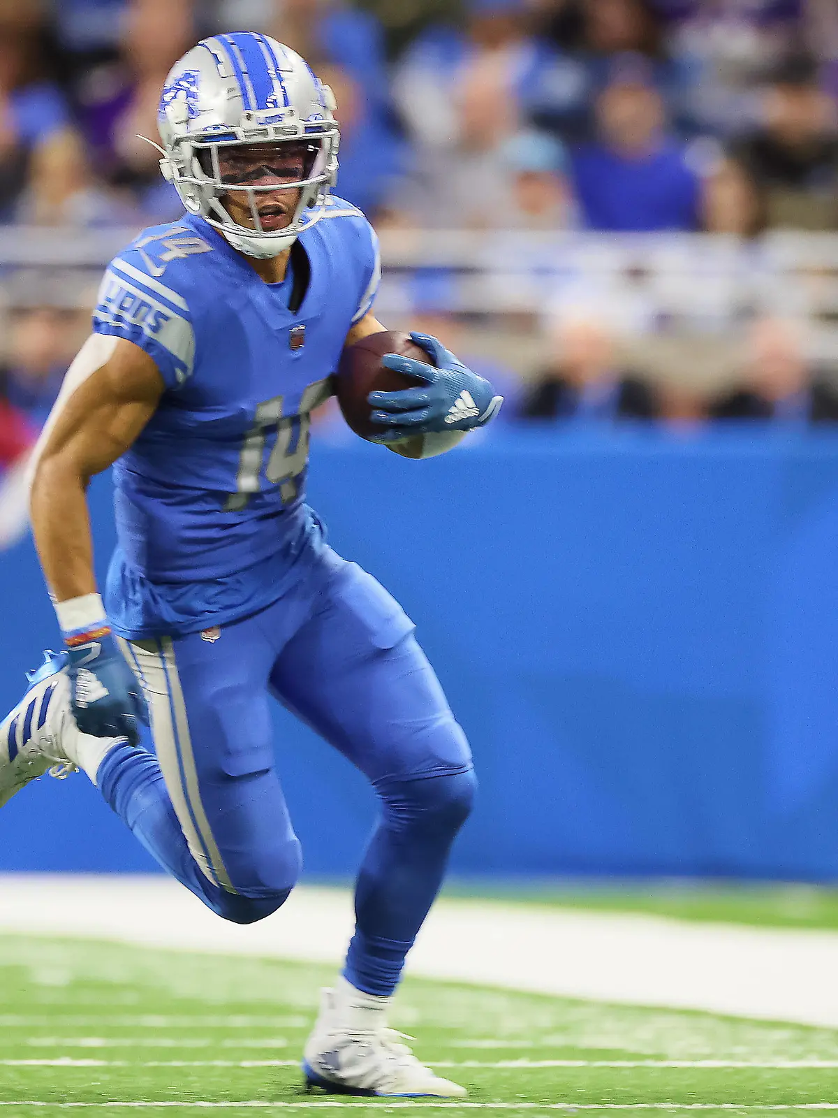 Detroit Lions vs Minnesota Vikings Detroit Lions wide receiver Amon-Ra St. Brown 14 carries the ball for yardage during an NFL, American Football Herren, USA football game between the Detroit Lions and the Minnesota Vikings in Detroit, Michigan USA, on Sunday, December 11, 2022. Detroit Michigan United States PUBLICATIONxNOTxINxFRA Copyright: xAmyxLemusx originalFilename:lemus-detroitl221211_npZge.jpg 
