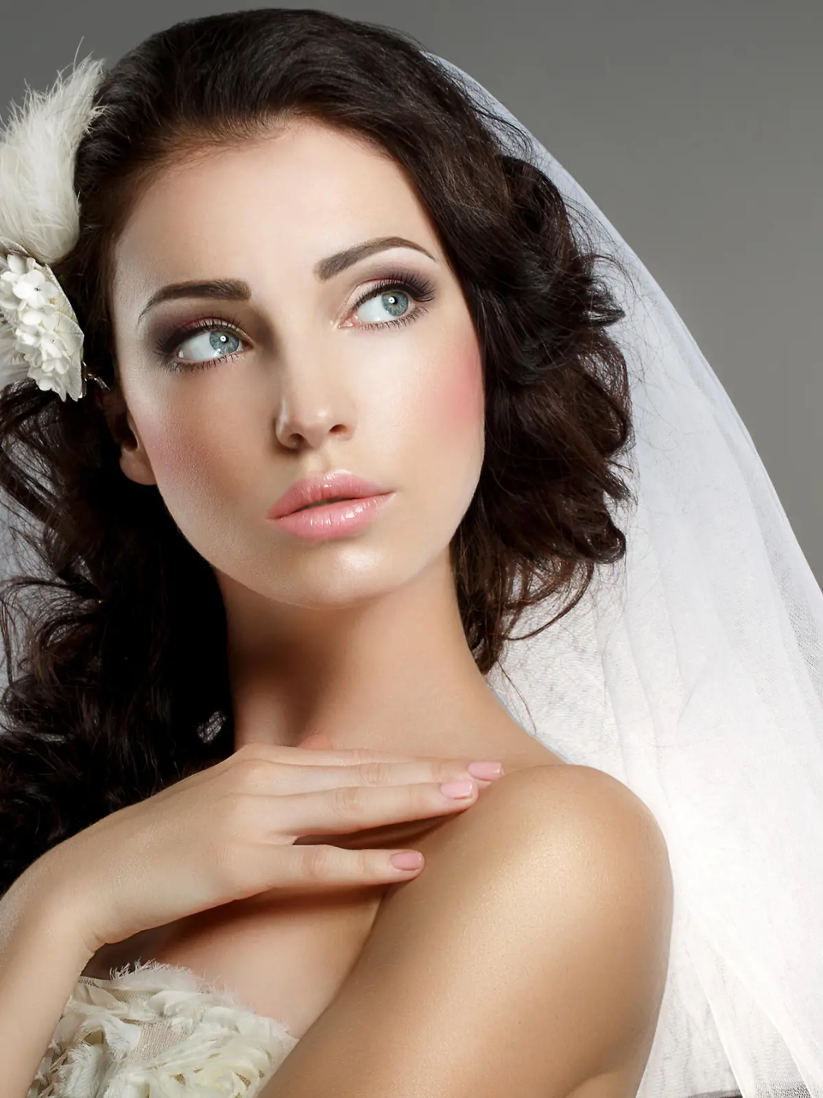 Wedding. Young Gentle Quiet Bride in Classic White Veil Looking Away