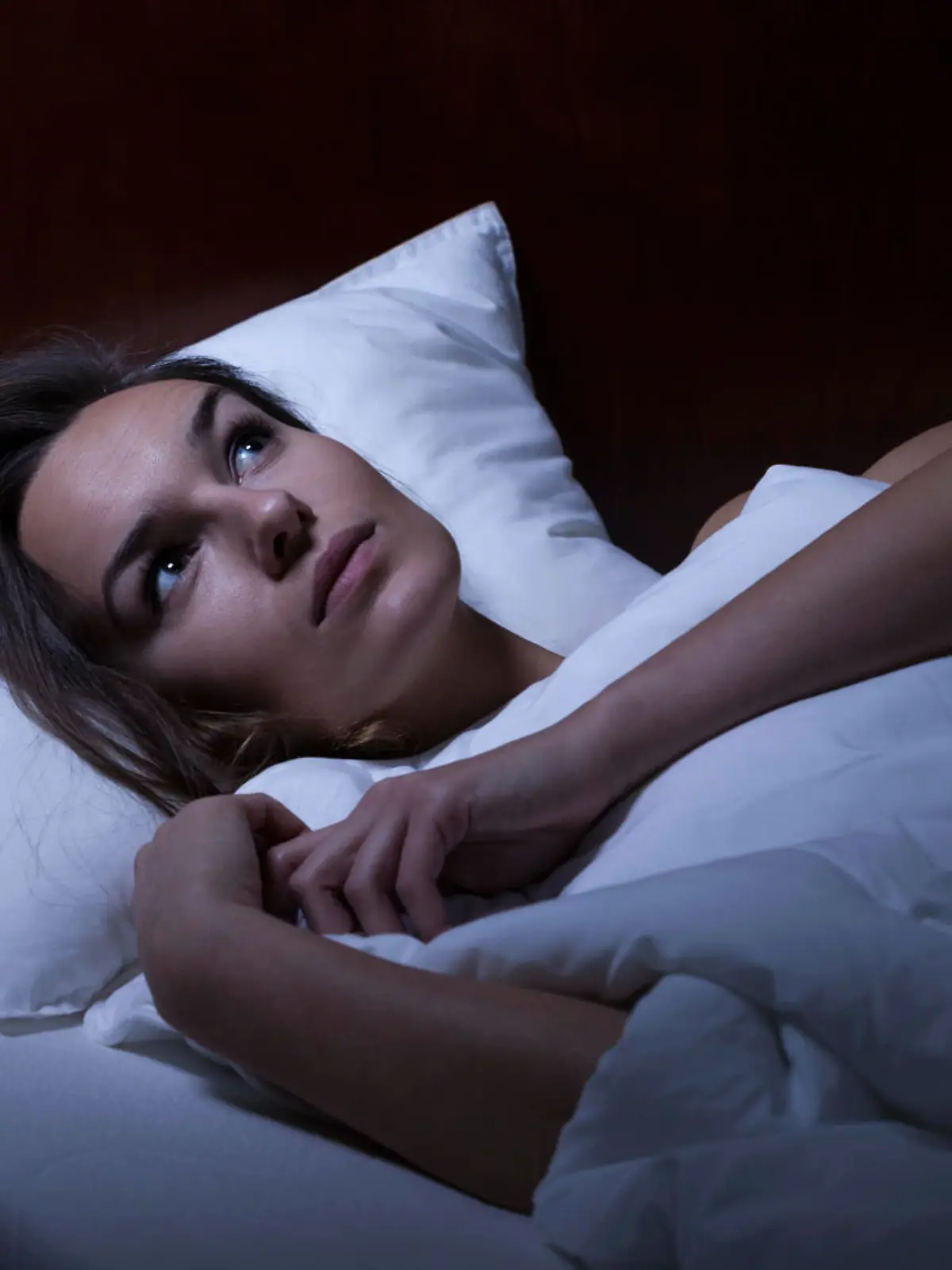 View of woman feeling depression in bed