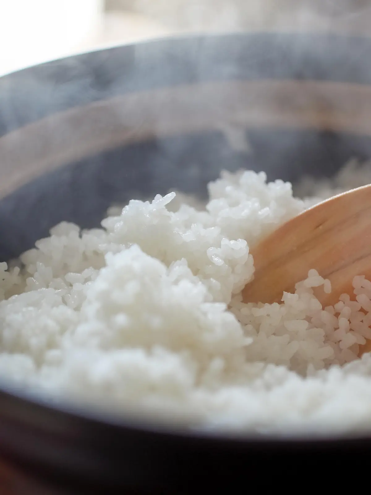 Hot cooked rice with steam rising.