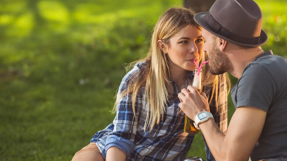 Couple sharing a drink on a romantic date.
