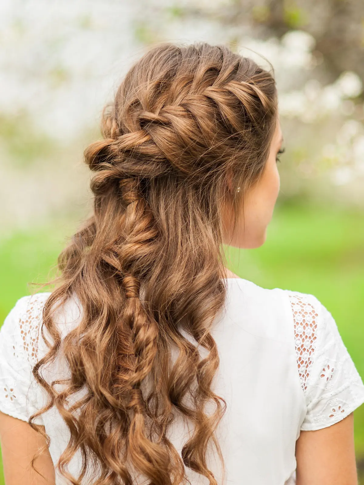 Girl with beautiful  braid hairstyle, rear view