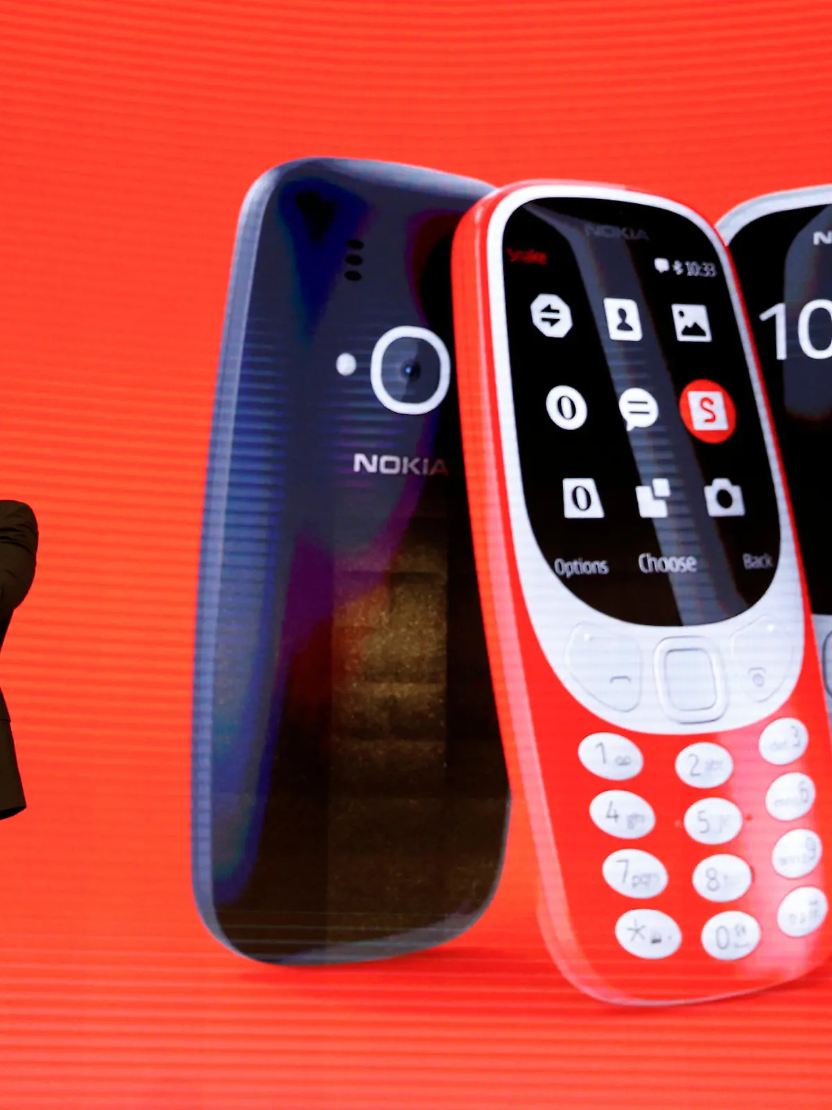 Arto Nummela, CEO of Nokia-HMD, holds up a Nokia 3310 device during a presentation ceremony at Mobile World Congress in Barcelona, Spain, February 26, 2017. REUTERS/Paul Hanna