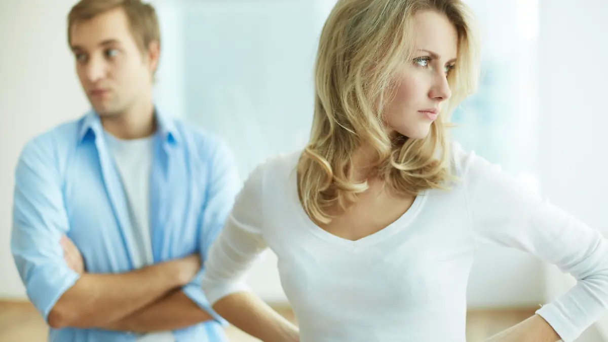 Image of young upset female in quarrel with her husband