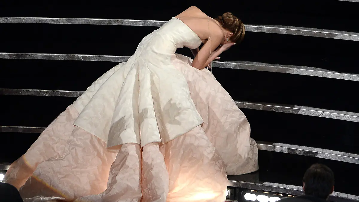 HOLLYWOOD, CA - FEBRUARY 24: Actress Jennifer Lawrence reacts after winning the Best Actress award for "Silver Linings Playbook" during the Oscars held at the Dolby Theatre on February 24, 2013 in Hollywood, California. (Photo by Kevin Winter/Getty Images)