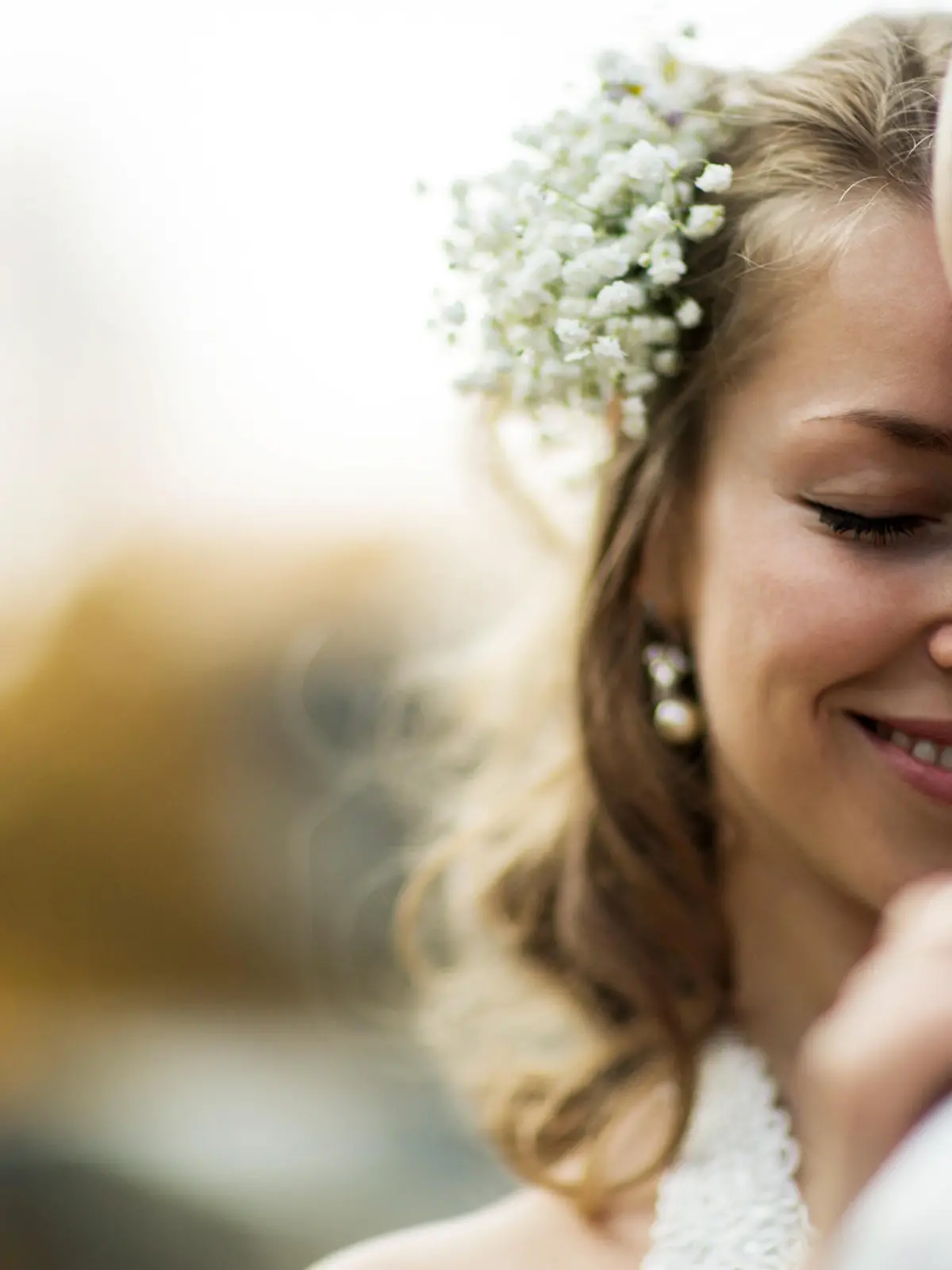 beautiful couple enjoying embrace of each other and tenderly smiling