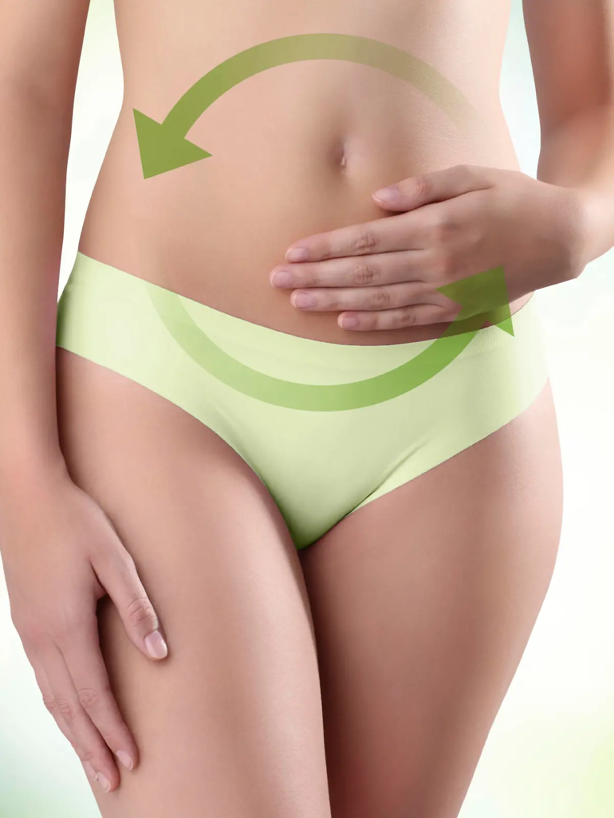 woman hands on belly with green arrow