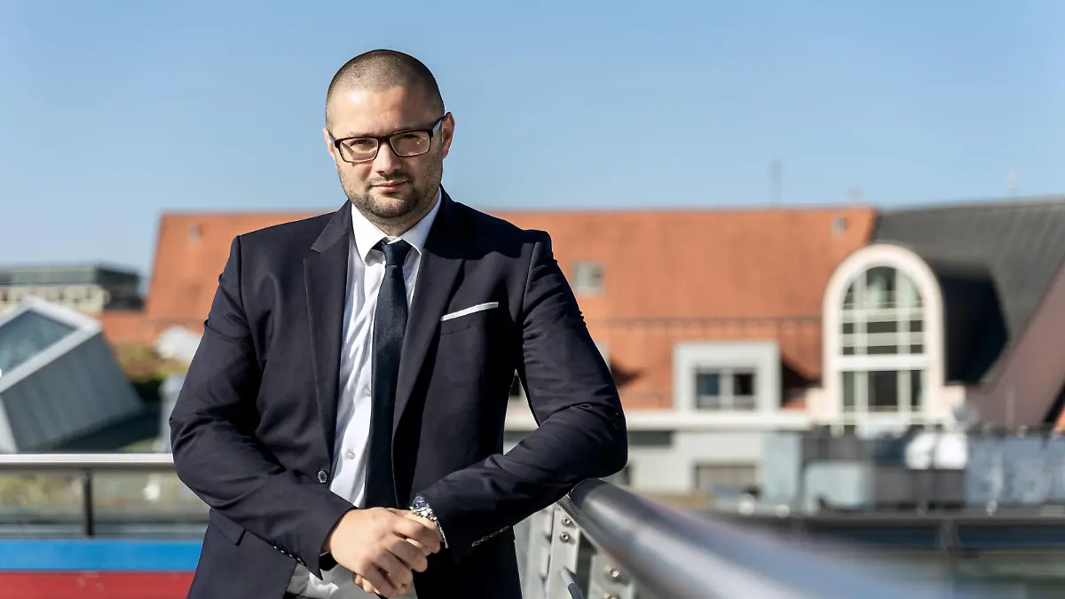 Augsburg, Bavaria, Germany - 06 September 2021: Mr. Andreas Jurca, city councilor of the party Afd Alternative for Germany above the rooftops of Augsburg makes preparations for the election campaign for the Bundestag election 2021 *** Herr Andreas Jurca, Stadtrat der Partei Afd Alternative für Deutschland über den Dächern Augsburgs trifft Vorbereitungen für den Wahlkampf für die Bundestagswahl 2021