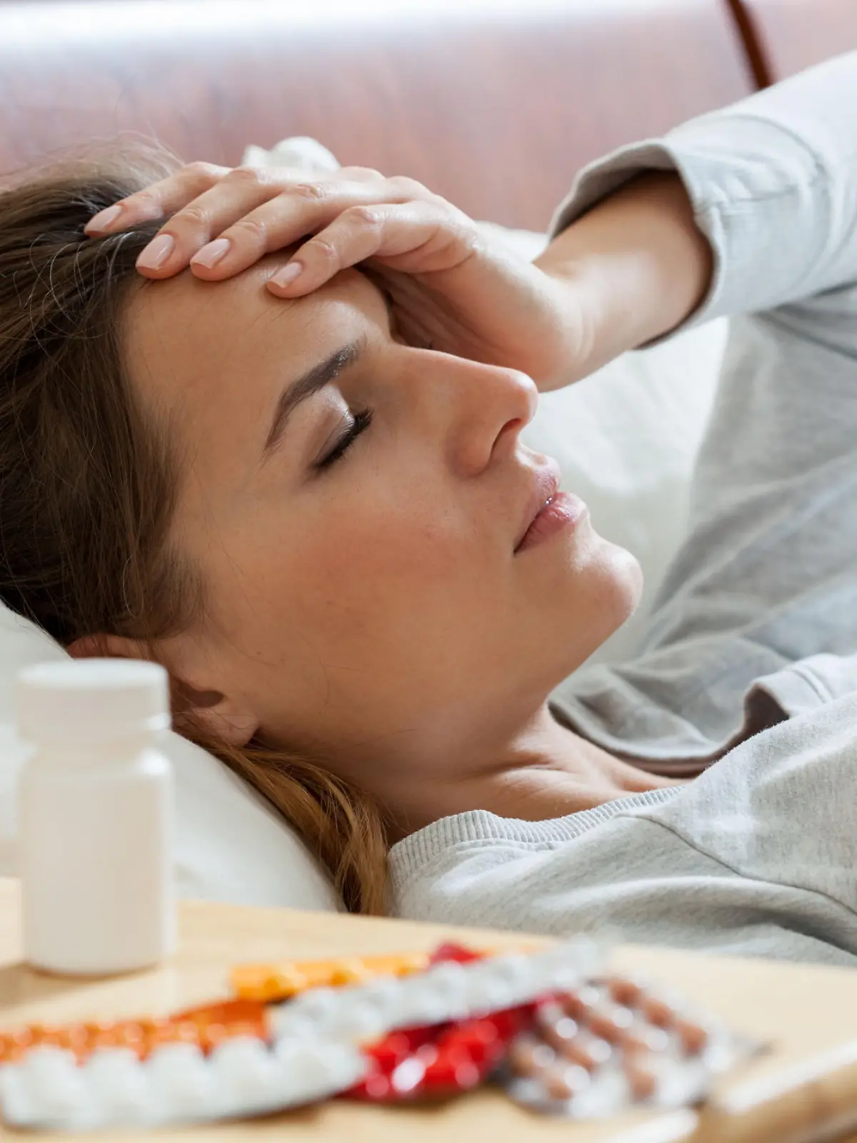 Horizontal view of woman suffering from flu