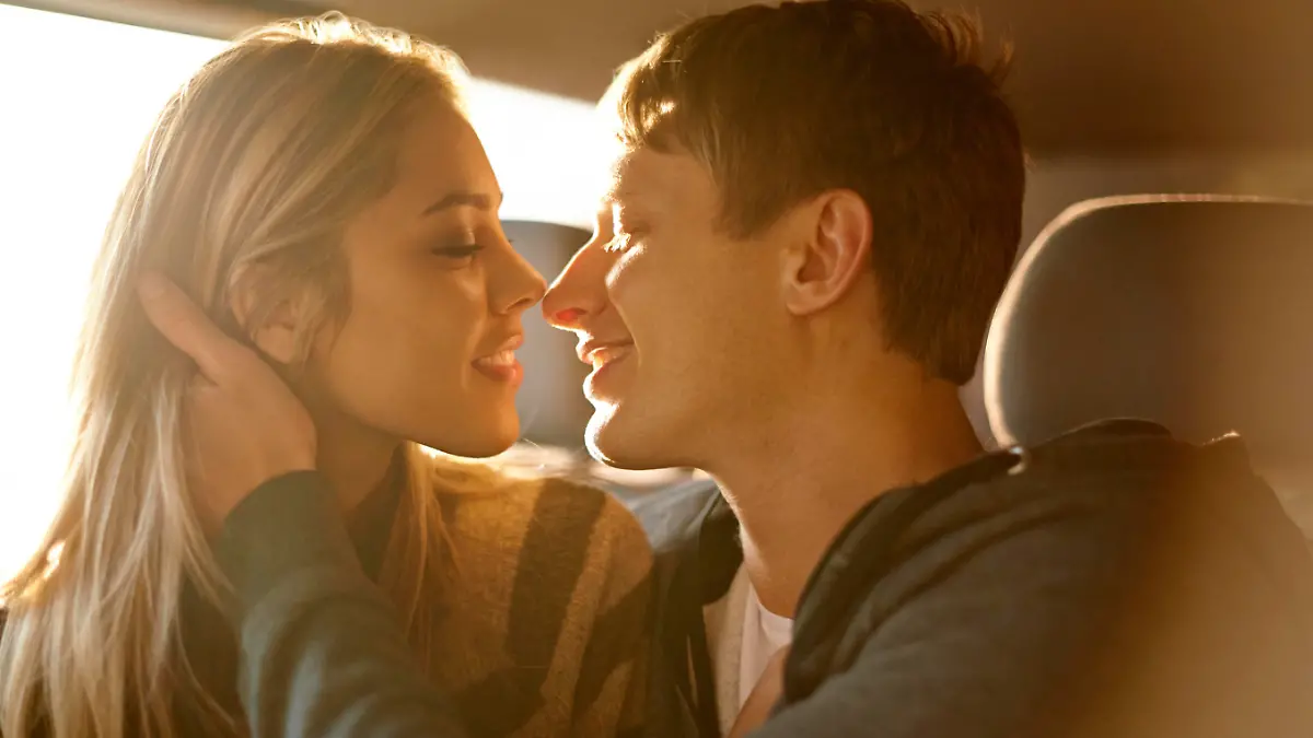 Shot of an affectionate young couple about to kiss in a car