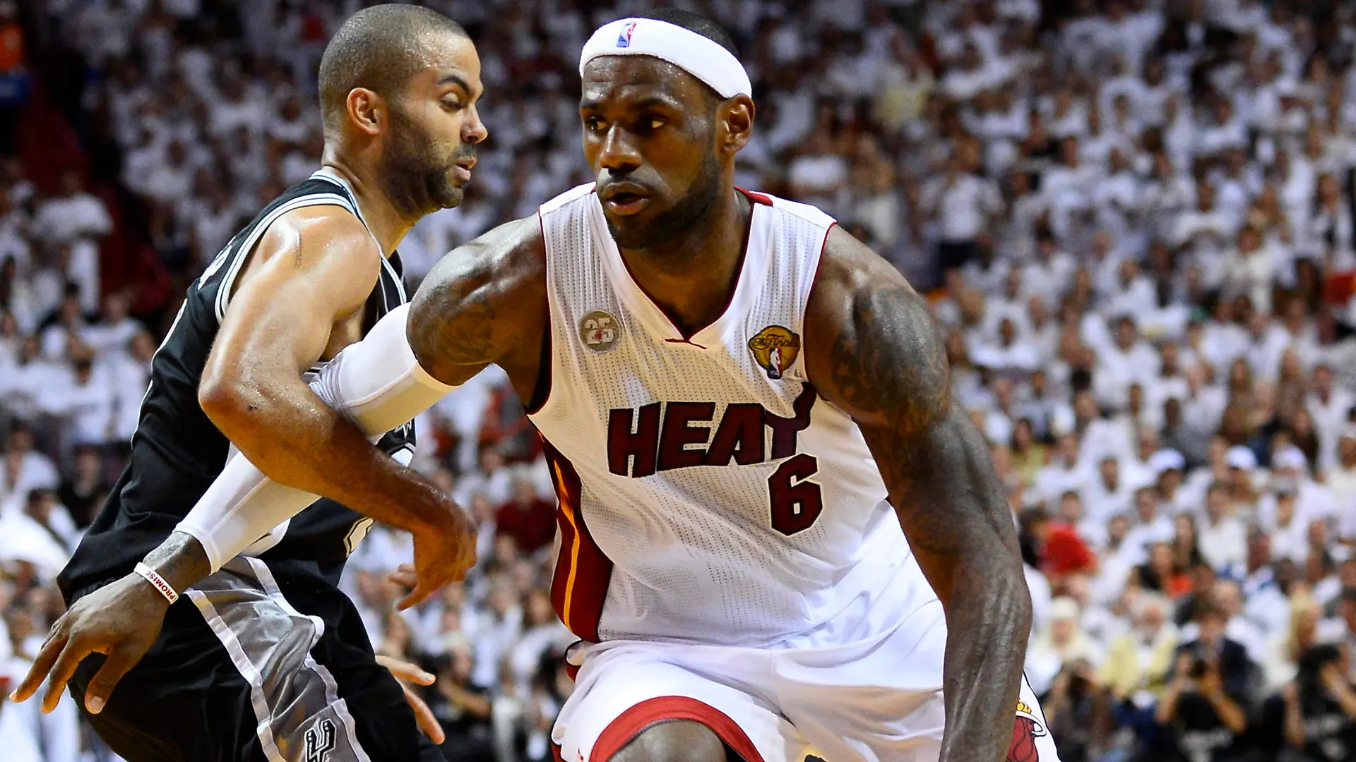 epa03753849 Miami Heat small forward LeBron James (R) drives past San Antonio Spurs point guard Tony Parker (L) during the first half of game seven of the NBA Finals at the American Airlines Arena in Miami, Florida, USA, 20 June 2013. The winner of game seven will be the NBA Finals Champion. EPA/LARRY W. SMITH CORBIS OUT ++