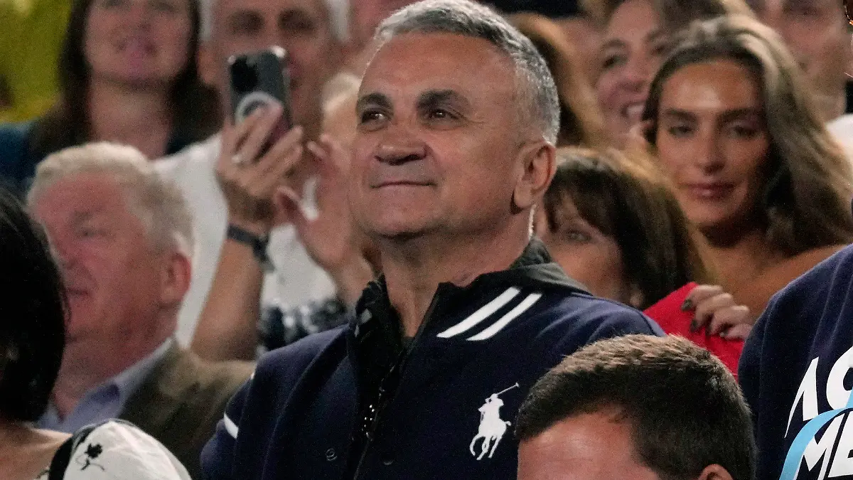 The parents of Novak Djokovic of Serbia, father Srdjan and mother Dijana react during his post match speech following his win over Andrey Rublev of Russia at the Australian Open tennis championship in Melbourne, Australia, Wednesday, Jan. 25, 2023. (AP Photo/Dita Alangkara)