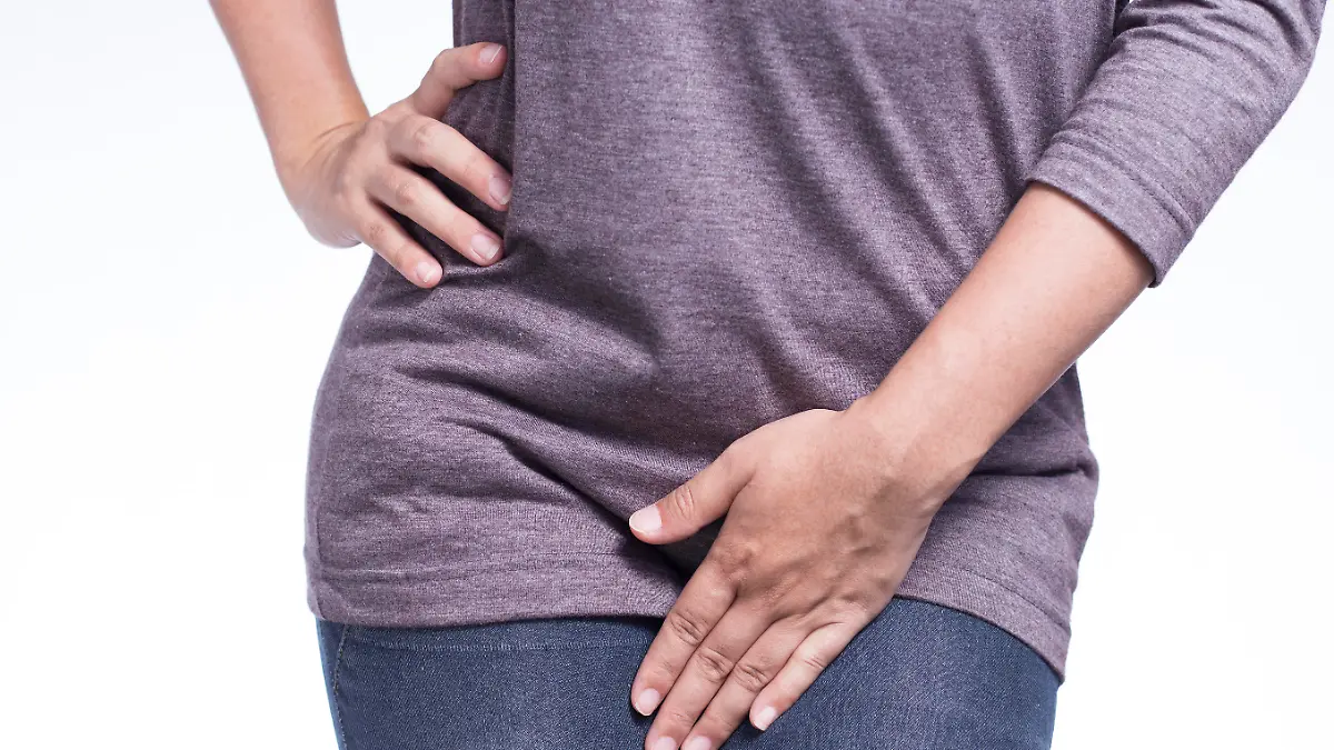 Woman with Hands Holding Her Crotch