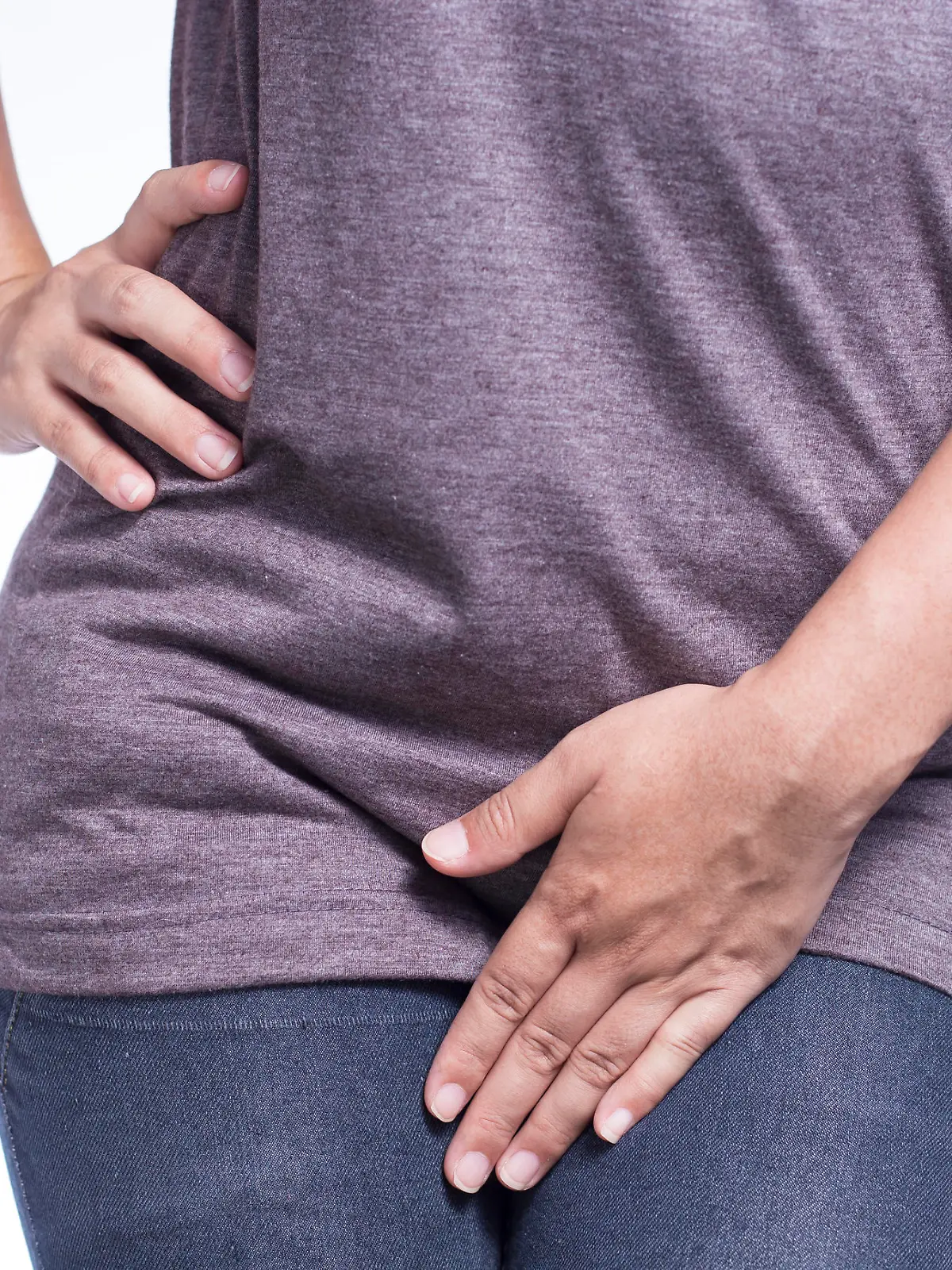 Woman with Hands Holding Her Crotch