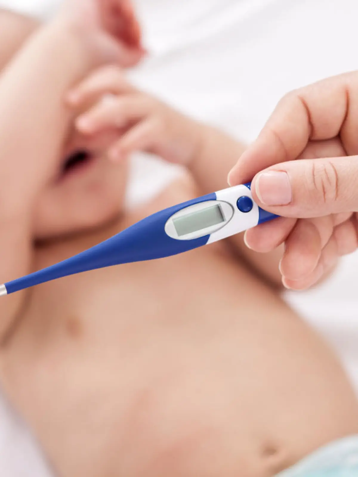 Fever, measuring temperature for little baby child