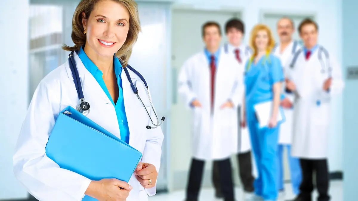 Smiling family doctor woman with stethoscope. Health care.
