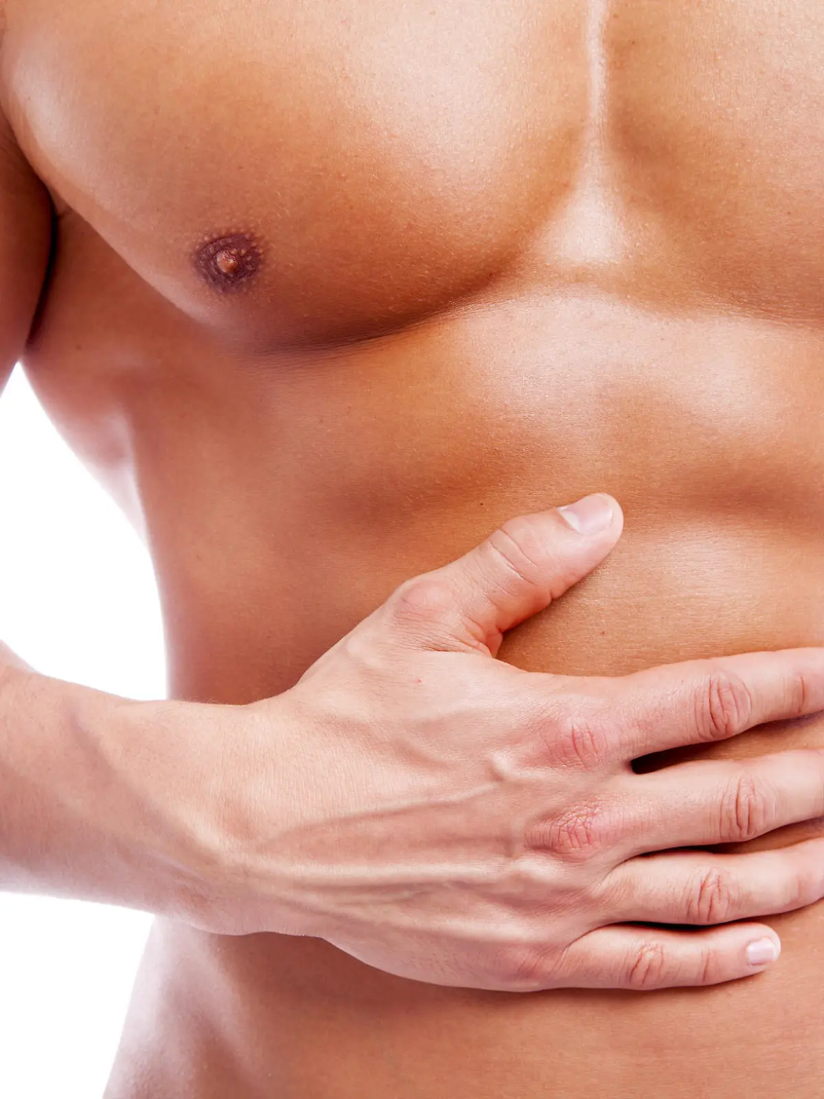 Muscular man having stomach pain, isolated on white background