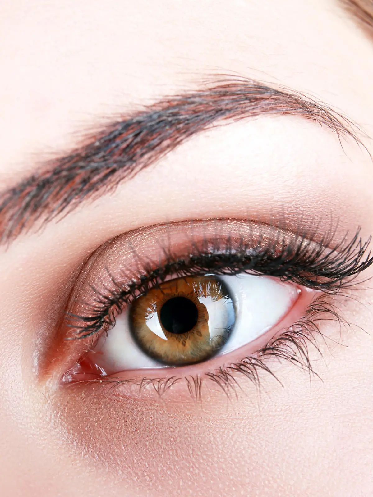 Female eye with long eyelashes close up