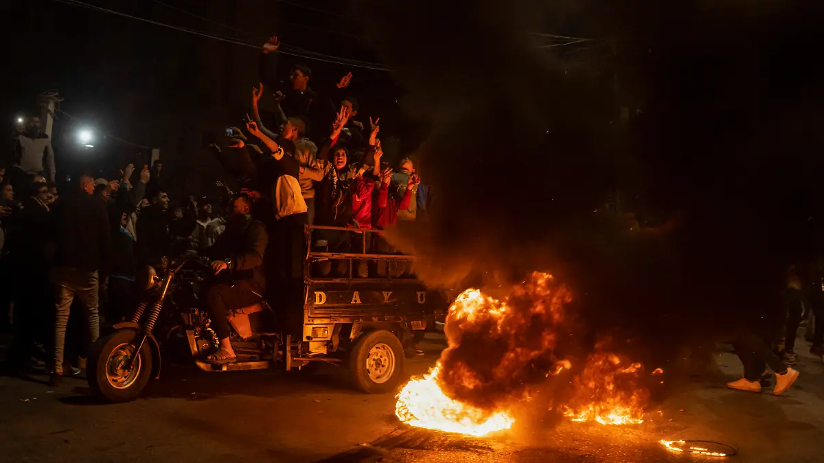 Palestinians celebrate after a shooting attack near a synagogue in Jerusalem, in Gaza City, Friday, Jan. 27, 2023. A Palestinian gunman opened fire outside an east Jerusalem synagogue Friday night, killing seven people, including a 70-year-old woman, and wounding three others before police shot and killed him, officials said. It was the deadliest attack on Israelis in years and raised the likelihood of further bloodshed.(AP Photo/Fatima Shbair)