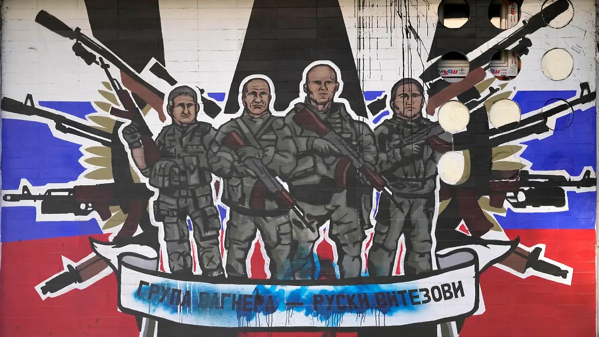 FILE - A mural depicting mercenaries of Russia's Wagner Group that reads: "Wagner Group - Russian knights" vandalized with paint on a wall in Belgrade, Serbia, on Jan. 13, 2023. Russia's Wagner Group, a private military company led by Yevgeny Prigozhin, a rogue millionaire with longtime links to Russia's President Vladimir Putin, has played an increasingly visible role in the fighting in Ukraine. (AP Photo/Darko Vojinovic, File)