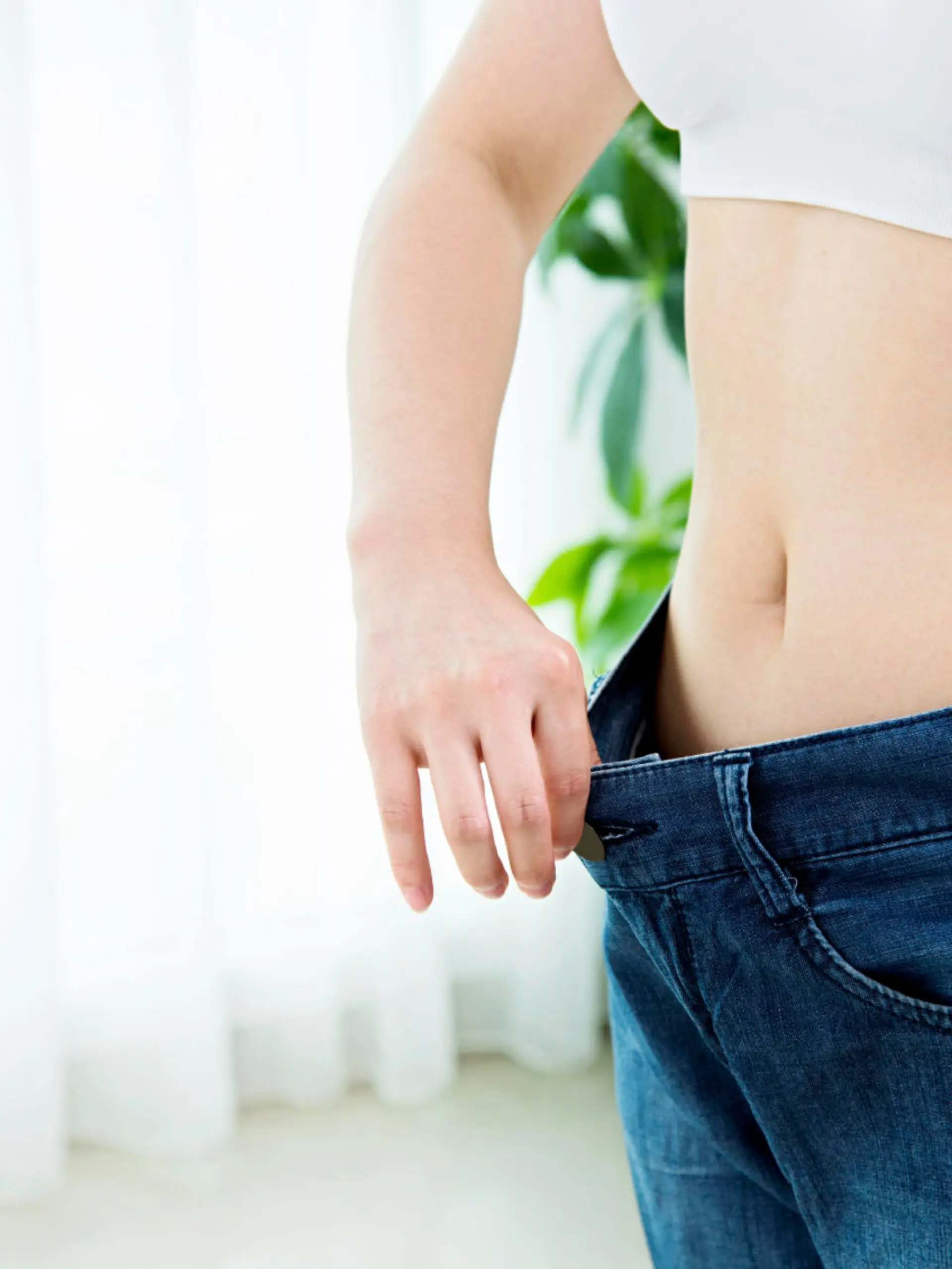 Young asian woman losing weight success.