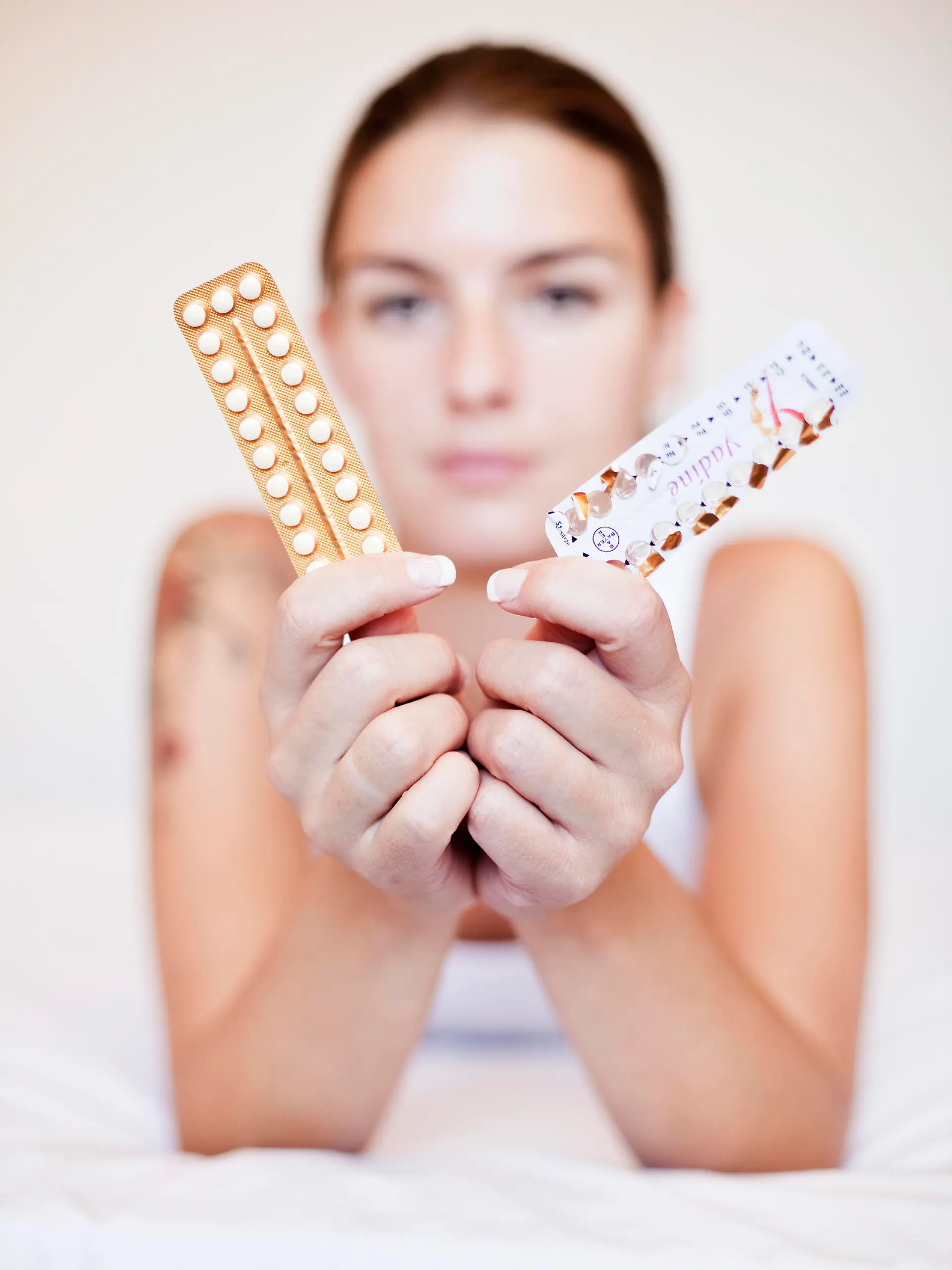 Young woman with contraceptive pills, birth-control pill, blister pack of combined oral contraceptive pills, birth control, prevention of pregnancy. (CTK Photo/Josef Horazny, Martin Sterba)