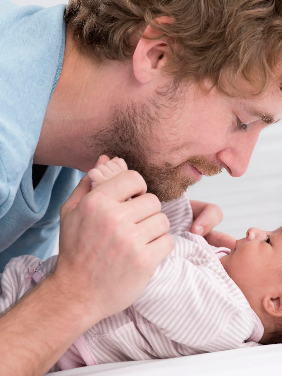 Father playing with his little baby. Quality time father and daughter.