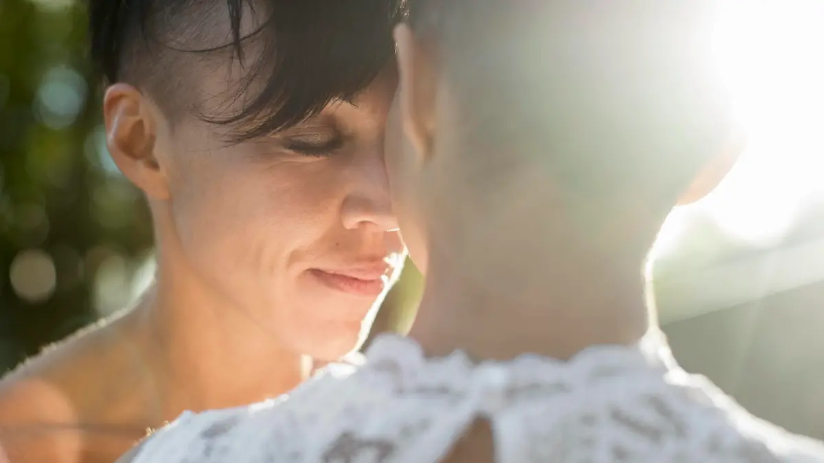 Close-up of newlywed lesbian couple embracing outdoors , model released Copyright: xMaskotx , MA52062