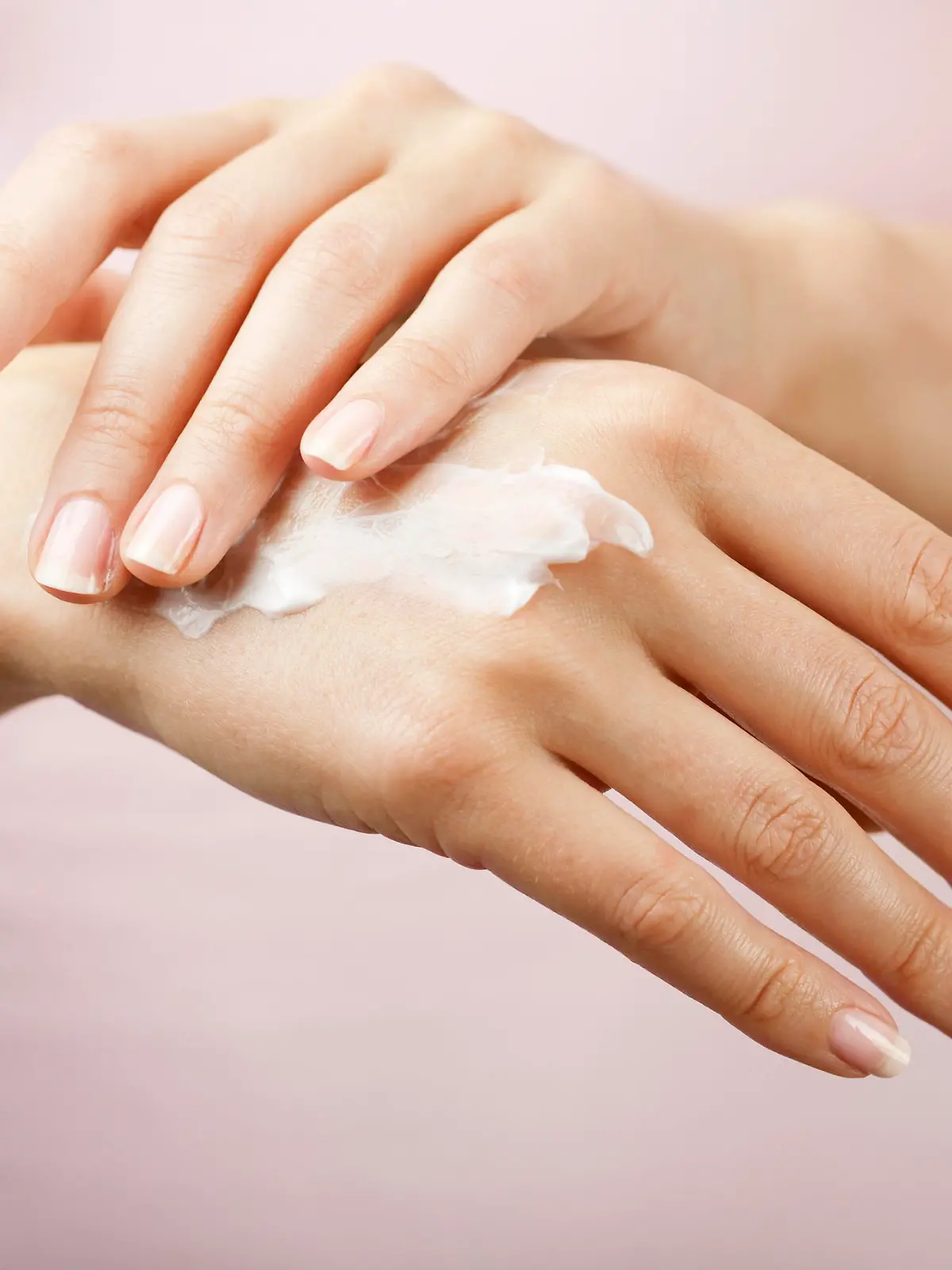 beautiful woman hands with cream