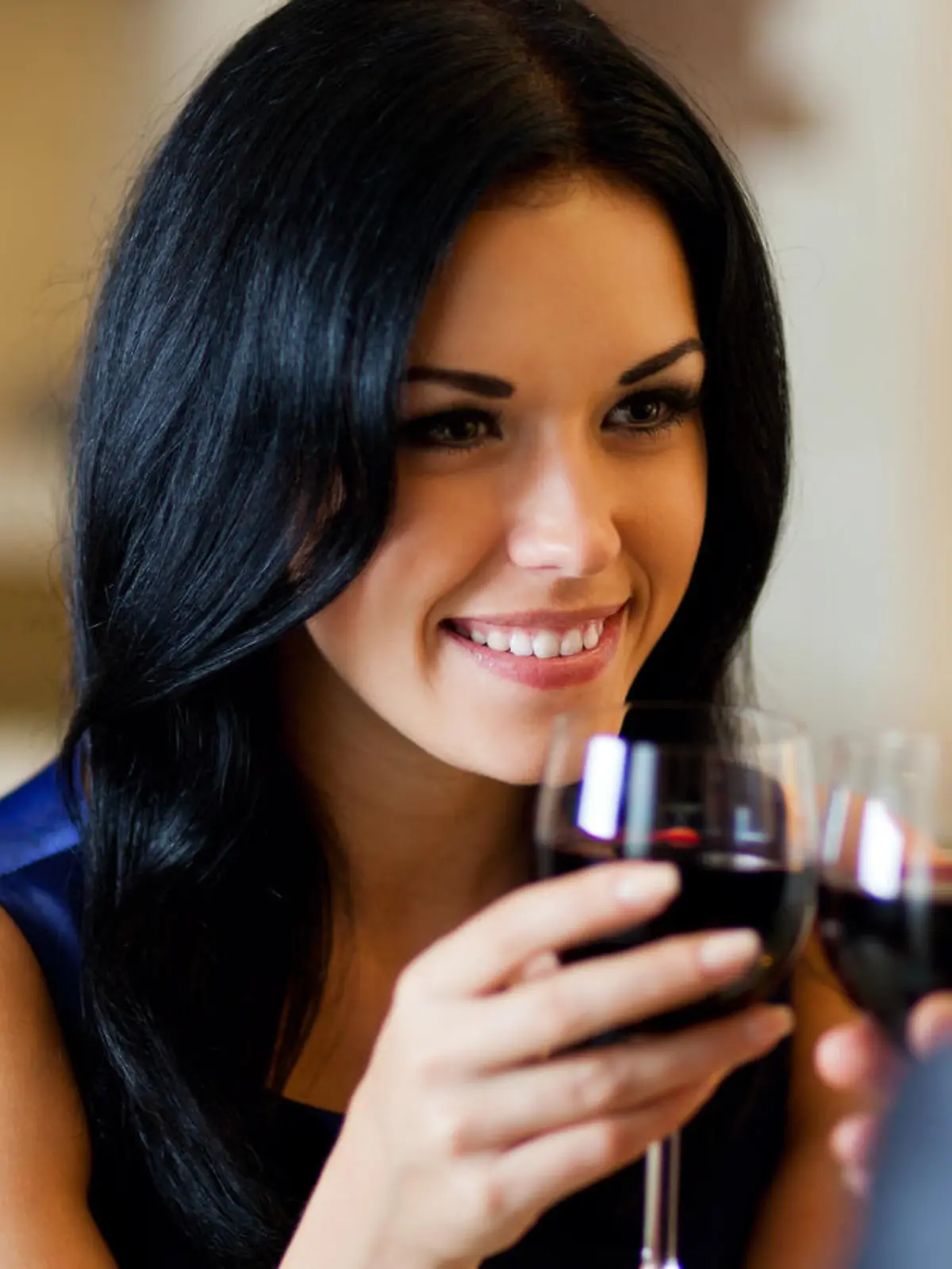 Young happy couple romantic date drink glass of red wine at restaurant, celebrating valentine day