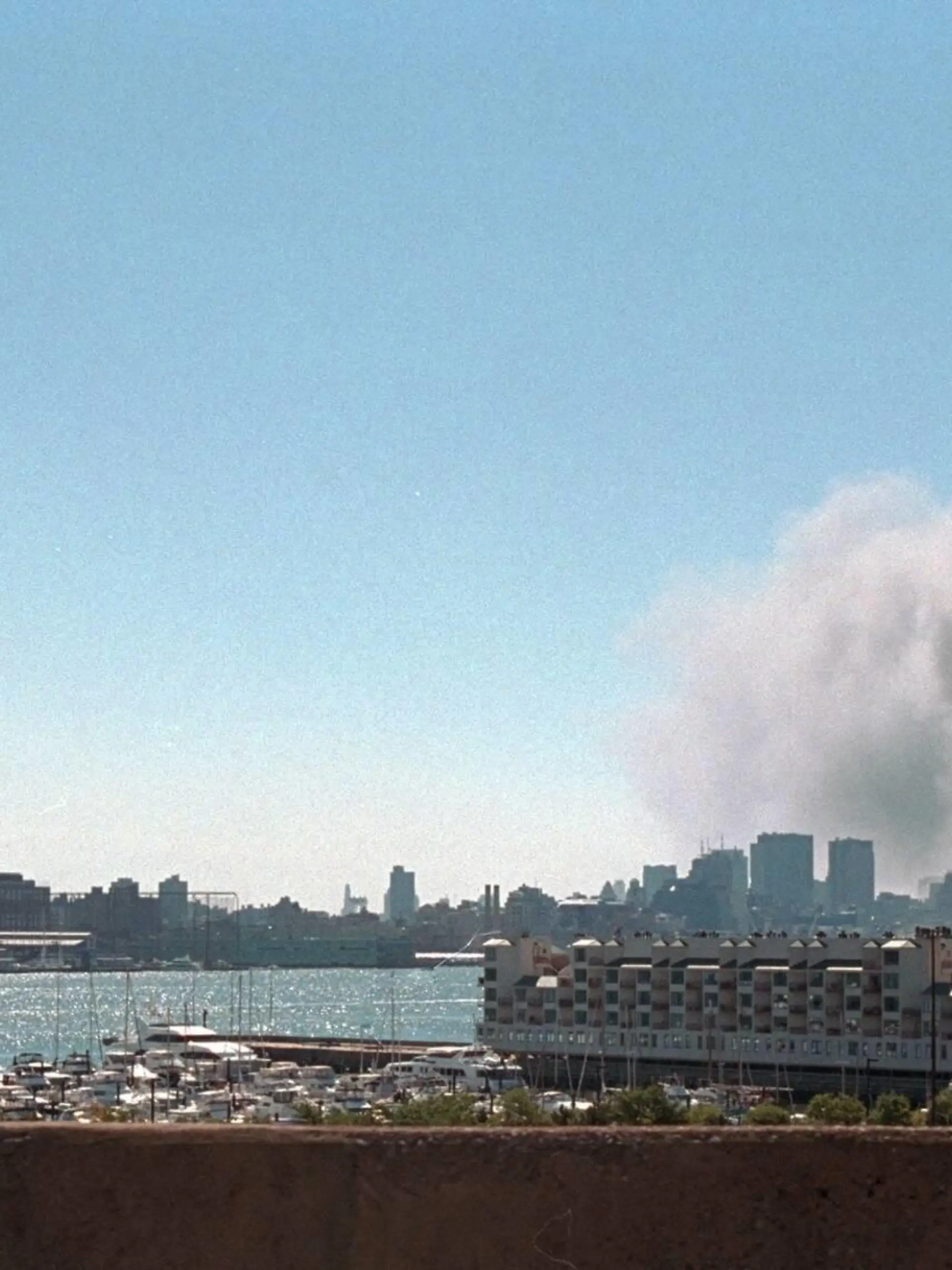 Smoke and pulverized building debris rise from the World Trade Center, Tuesday, Sept. 11, 2001. Photo taken from New Jersey after the North Tower collapsed at 10:28 AM. New York City, Sept. 11, 2001. BSLOC2015240 For usage credit please use The George W. Bush Presidential Library PUBLICATIONxINxGERxSUIxAUTxONLY Copyright: xCourtesyxEverettxCollectionx HISL040 EC045