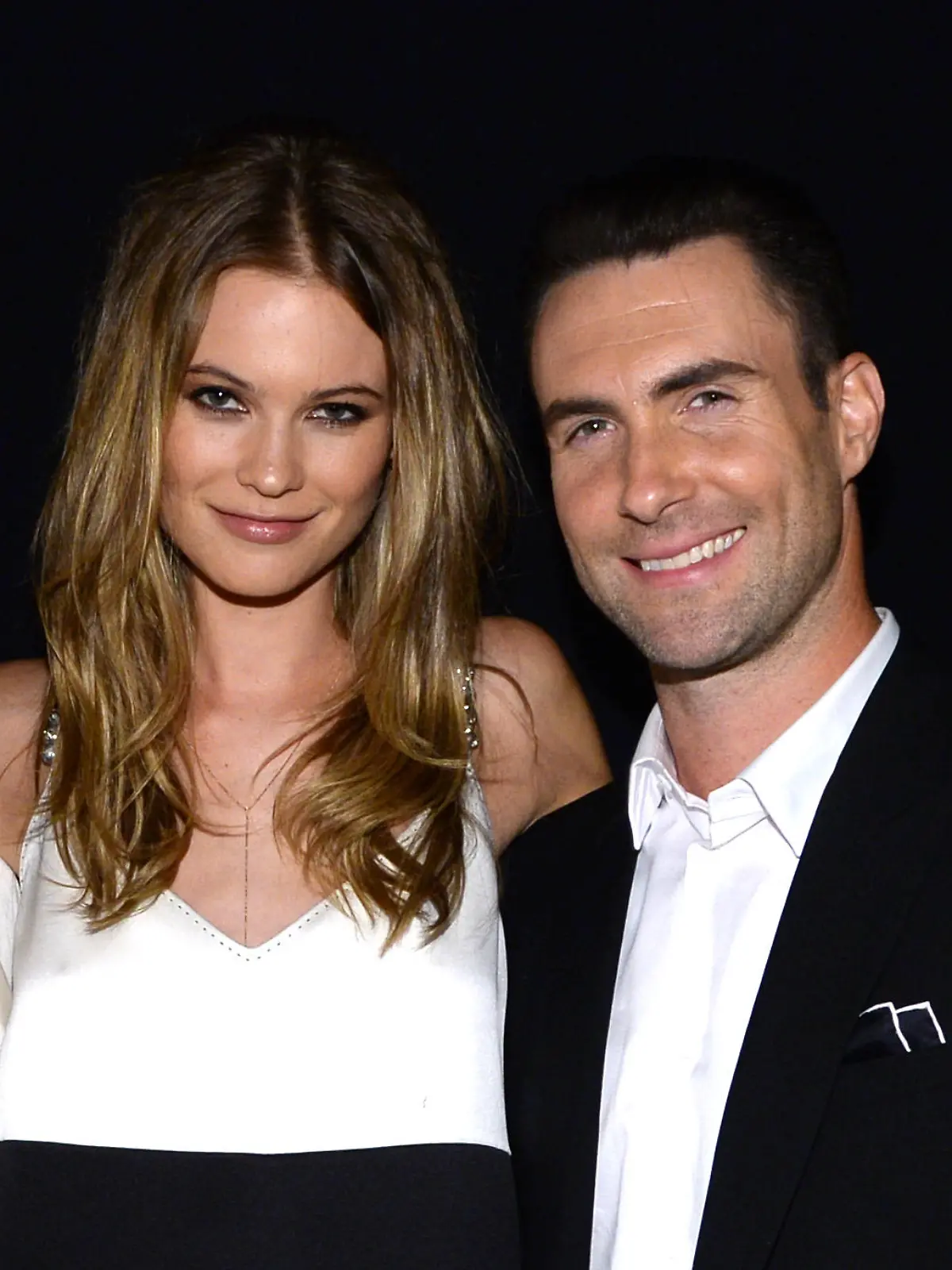 LOS ANGELES, CA - JANUARY 27:  (L-R) Model Behati Prinsloo and recording artist Adam Levine of Maroon 5 attend "The Night That Changed America: A GRAMMY Salute To The Beatles" at the Los Angeles Convention Center on January 27, 2014 in Los Angeles, California.  (Photo by Larry Busacca/Getty Images for NARAS)