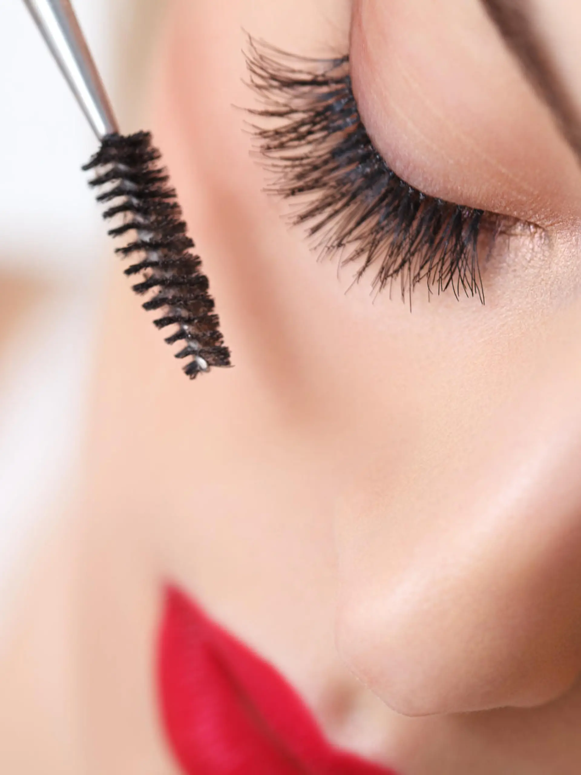 Woman eye with beautiful makeup and long eyelashes. Mascara Brush. High quality image.